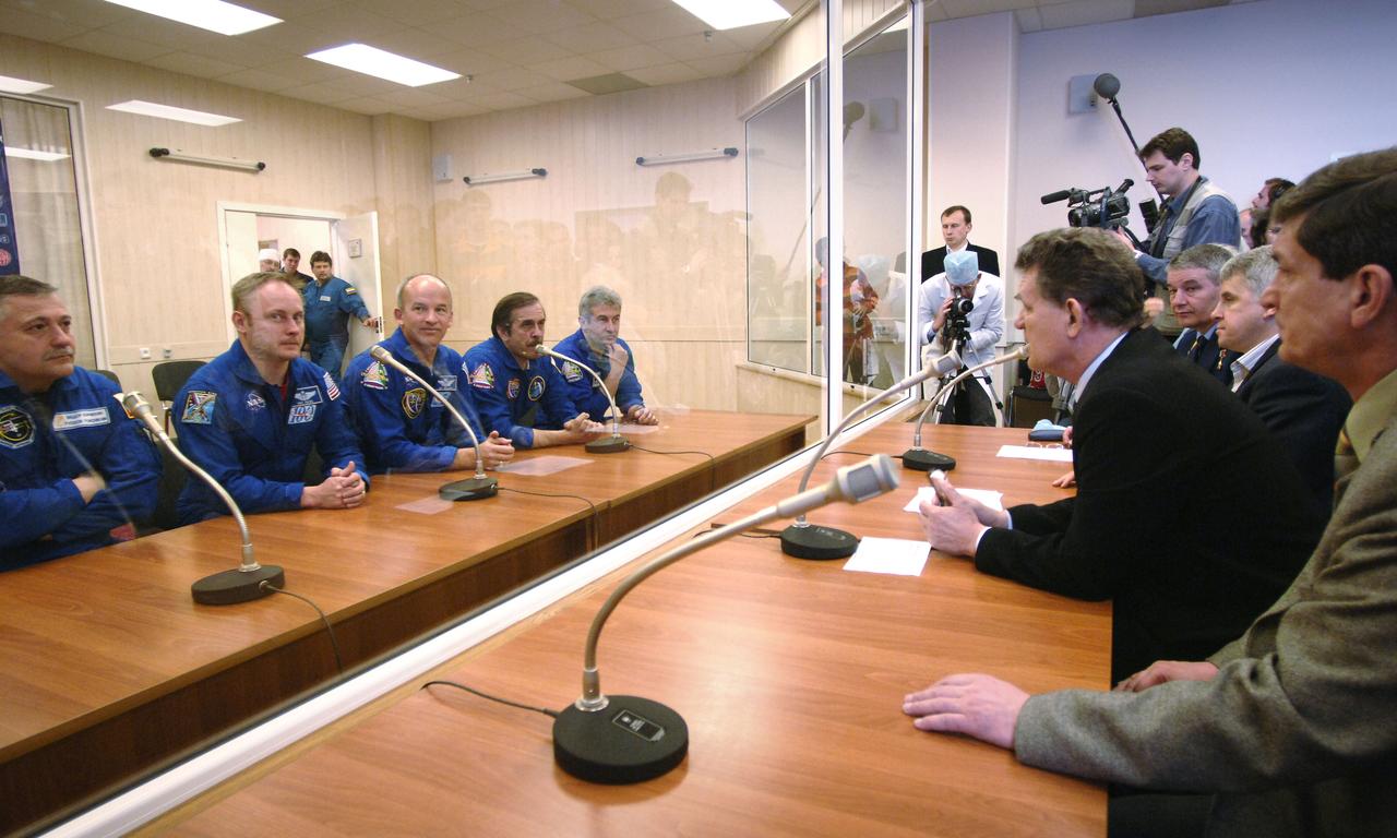 Prime and backup crew members for the Expedition 13 mission talk with officials at building 254 of the Baikonur Cosmodrome during their final check of the Soyuz spacecraft. Backup crew members, left to right, Fyodor N. Yurchikhin, Commander; Michael Fincke, NASA International Space Station Science Officer and Flight Engineer; and prime crew members Jeffrey N. Williams, NASA International Space Station Science Officer and Flight Engineer; Pavel V. Vinogradov, Commander; and Marcos Pontes, Brazilian Space Agency Soyuz crew member. Sunday, March 26, 2006. Photo Credit: (NASA/Bill Ingalls)