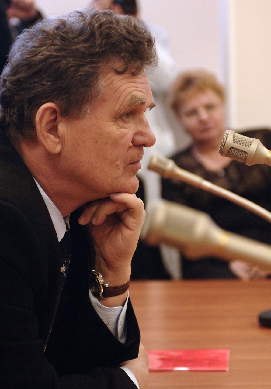 Nikolai Zelenschikov, Deputy General Designer, RSA- Energia, listens to the Expedition 13 crew members talk about their final check of the Soyuz spacecraft at building 254 of the Baikonur Cosmodrome in Baikonur, Kazakhstan, Sunday, March 26, 2006. Photo Credit: (NASA/Bill Ingalls)