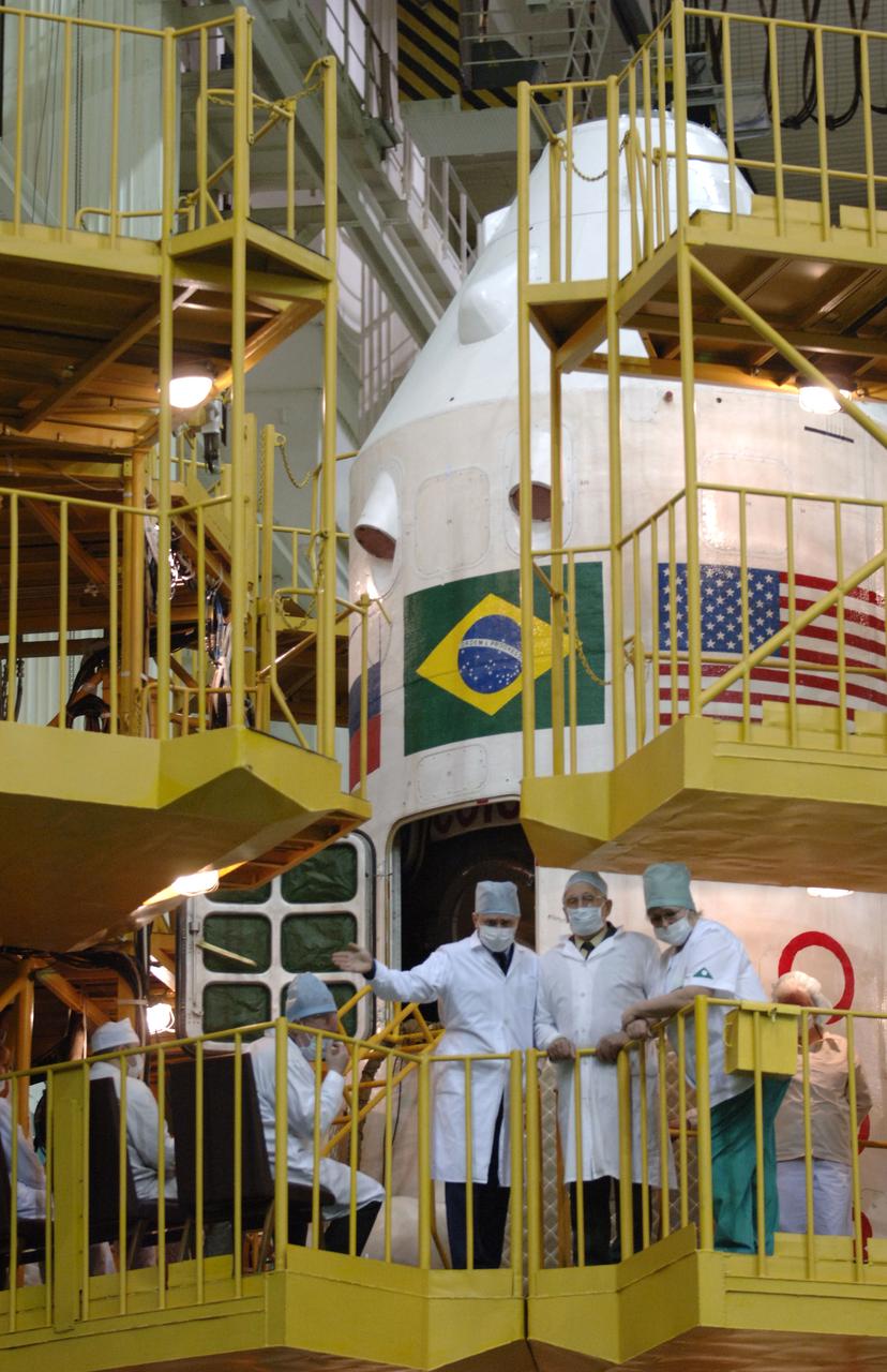 Workers atop the Soyuz work stand await the International Space Station Expedition 13 crew members, Jeffrey N. Williams, NASA International Space Station Science Officer and Flight Engineer; Pavel V. Vinogradov, Commander; and Marcos Pontes, Brazilian Space Agency Soyuz crew member. The crew members did their final check of the Soyuz at building 254 of the Baikonur Cosmodrome in Baikonur, Kazakhstan. Sunday, March 26, 2006. Photo Credit: (NASA/Bill Ingalls)