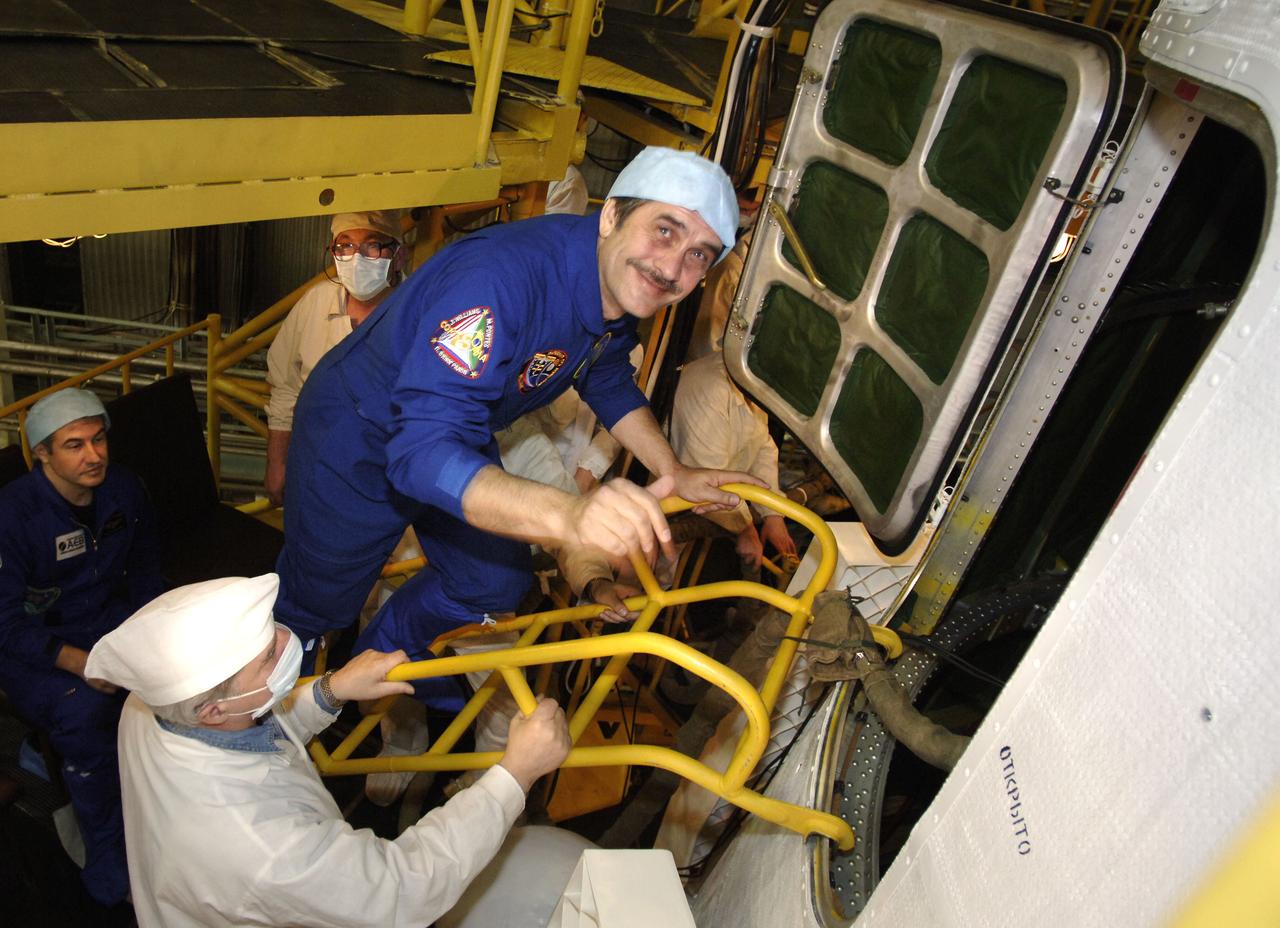 Expedition 13 Commander Pavel V. Vinogradov climbing into the Soyuz capsule for his final check at building 254 of the Baikonur Cosmodrome in Baikonur, Kazakhstan. Sunday, March 26, 2006. Photo Credit: (NASA/Bill Ingalls)