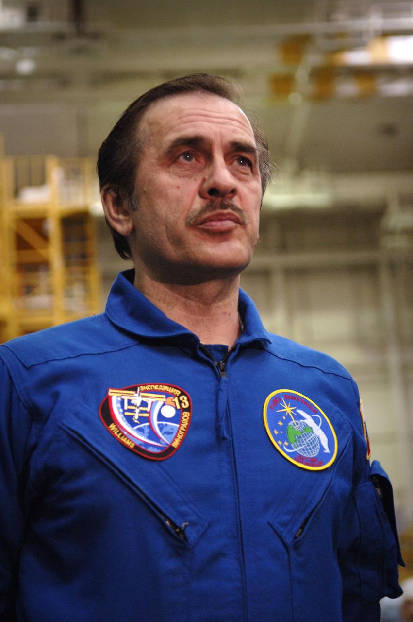 Cosmonaut Pavel V. Vinogradov, Russias Federal Space Agency Expedition 13 International Space Station Commander, talks with members of the media after the crew's final check of the Soyuz at building 254 of the Baikonur Cosmodrome in Baikonur, Kazakhstan. Sunday, March 26, 2006. Photo Credit: (NASA/Bill Ingalls)