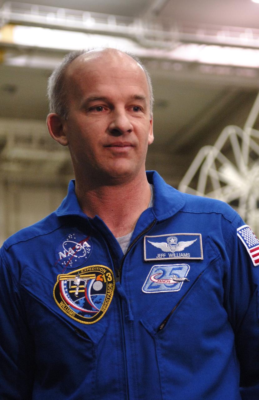 Astronaut Jeffrey N. Williams, Expedition 13 Science Officer and Flight Engineer, talks with members of the media after the crew's final check of the Soyuz at building 254 of the Baikonur Cosmodrome in Baikonur, Kazakhstan. Sunday, March 26, 2006. Photo Credit: (NASA/Bill Ingalls)