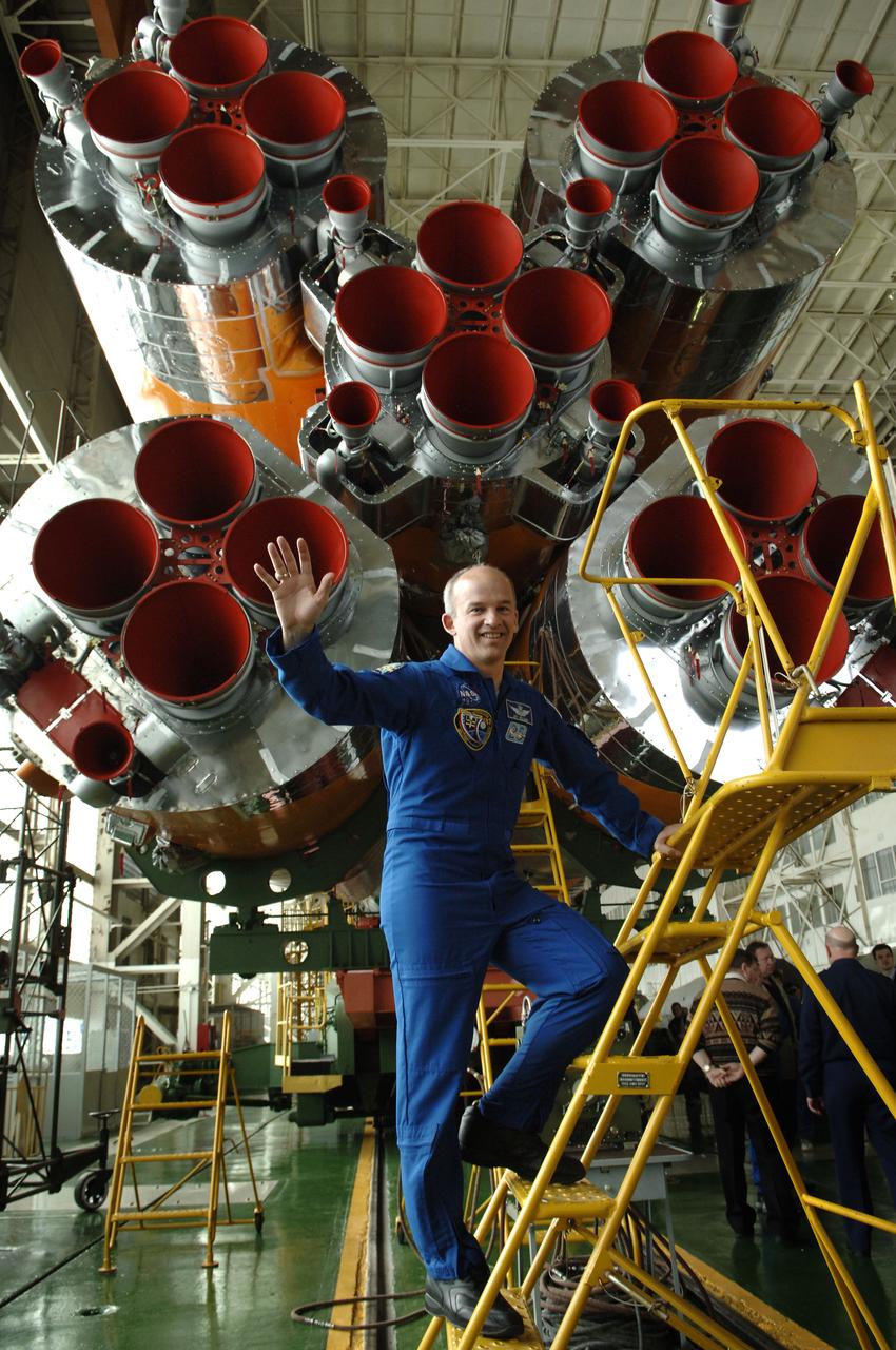 Jeffrey N. Williams, Expedition 13 Science Officer and Flight Engineer, waves at media representatives during a tour of the Soyuz assembly building at the Baikonur Cosmodrome in Baikonur, Kazakhstan. Sunday, March 26, 2006. Photo Credit: (NASA/Bill Ingalls)