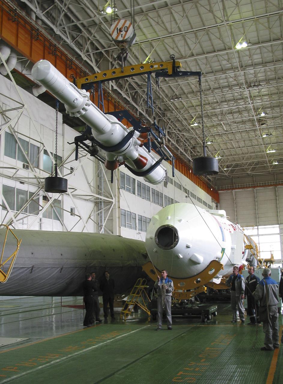 The Soyuz TMA-8 capsule was mated Monday, March 27, 2006, to its booster in preparation for the launch on March 30, 2006 carrying Expedition 13 crew members, Jeffrey N. Williams, Science Officer and Flight Engineer; Pavel V. Vinogradov, Russia’s Federal Space Agency International Space Station Commander; and Marcos Pontes, Brazilian Space Agency Soyuz crew member. Baikonur Cosmodrome in Baikonur, Kazakhstan. Photo Credit: (NASA/Victor Zelentsov)