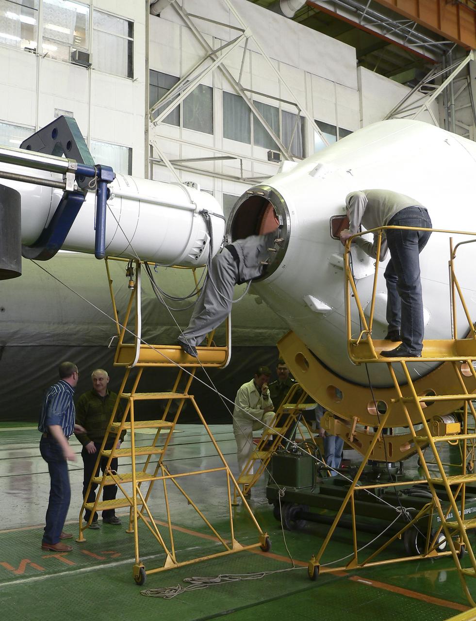 The Soyuz TMA-8 capsule was mated Monday, March 27, 2006, to its booster in preparation for the launch on March 30, 2006 carrying Expedition 13 crew members, Jeffrey N. Williams, Science Officer and Flight Engineer; Pavel V. Vinogradov, Russia’s Federal Space Agency International Space Station Commander; and Marcos Pontes, Brazilian Space Agency Soyuz crew member. Baikonur Cosmodrome in Baikonur, Kazakhstan. Photo Credit: (NASA/Victor Zelentsov)
