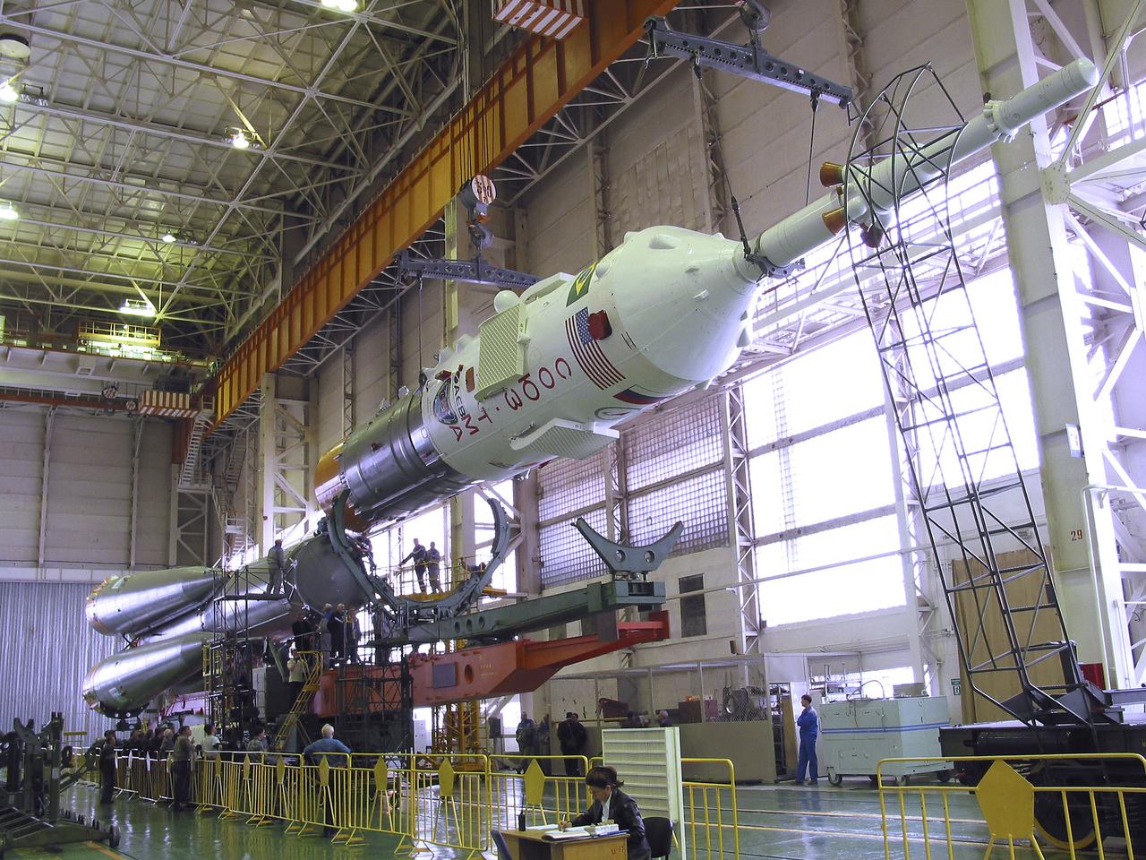The Soyuz TMA-8 capsule was mated Monday, March 27, 2006, to its booster in preparation for the launch on March 30, 2006 carrying Expedition 13 crew members, Jeffrey N. Williams, Science Officer and Flight Engineer; Pavel V. Vinogradov, Russia’s Federal Space Agency International Space Station Commander; and Marcos Pontes, Brazilian Space Agency Soyuz crew member. Baikonur Cosmodrome in Baikonur, Kazakhstan. Photo Credit: (NASA/Victor Zelentsov)