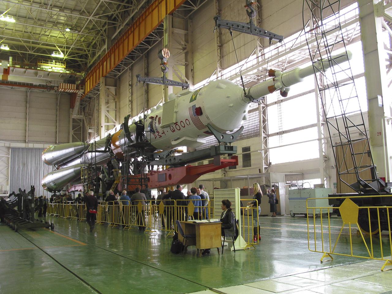 The Soyuz TMA-8 capsule was mated Monday, March 27, 2006, to its booster in preparation for the launch on March 30, 2006 carrying Expedition 13 crew members, Jeffrey N. Williams, Science Officer and Flight Engineer; Pavel V. Vinogradov, Russia’s Federal Space Agency International Space Station Commander; and Marcos Pontes, Brazilian Space Agency Soyuz crew member. Baikonur Cosmodrome in Baikonur, Kazakhstan. Photo Credit: (NASA/Victor Zelentsov)