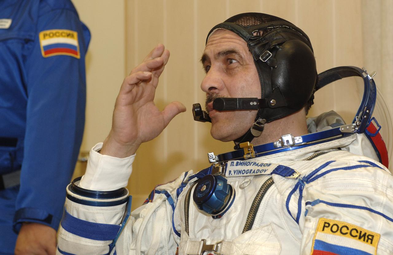 Expedition 13 Commander Pavel Vinogradov dons his pressure suit at building 254 of the Baikonur Cosmodrome in Baikonur, Kazakhstan, Thursday, March 30, 2006  prior launch onboard the Soyuz spacecraft.  Photo Credit: (NASA/Bill Ingalls)