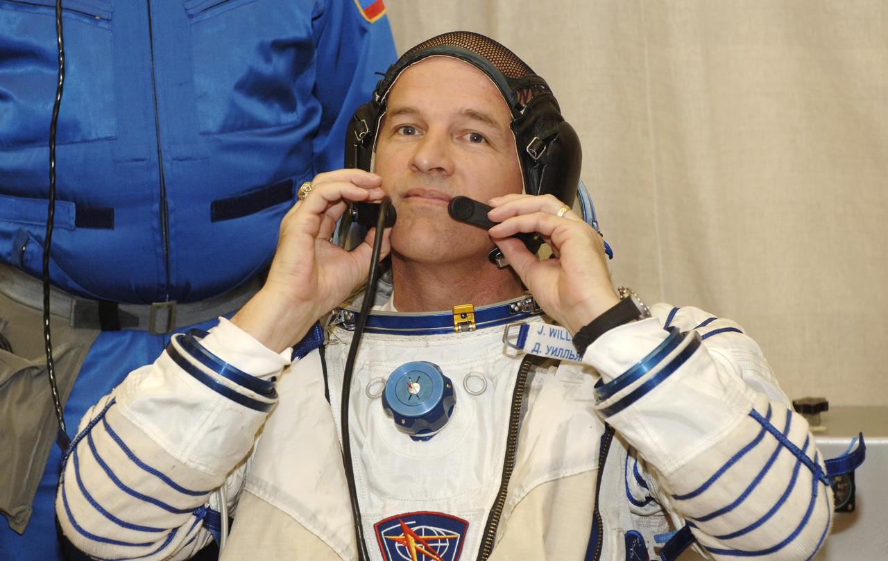 Expedition 13 Science Officer and Flight Engineer Jeffrey N. Williams dons his pressure suit at building 254 of the Baikonur Cosmodrome in Baikonur, Kazakhstan, Thursday, March 30, 2006 prior to launch onboard the Soyuz spacecraft. Photo Credit: (NASA/Bill Ingalls)