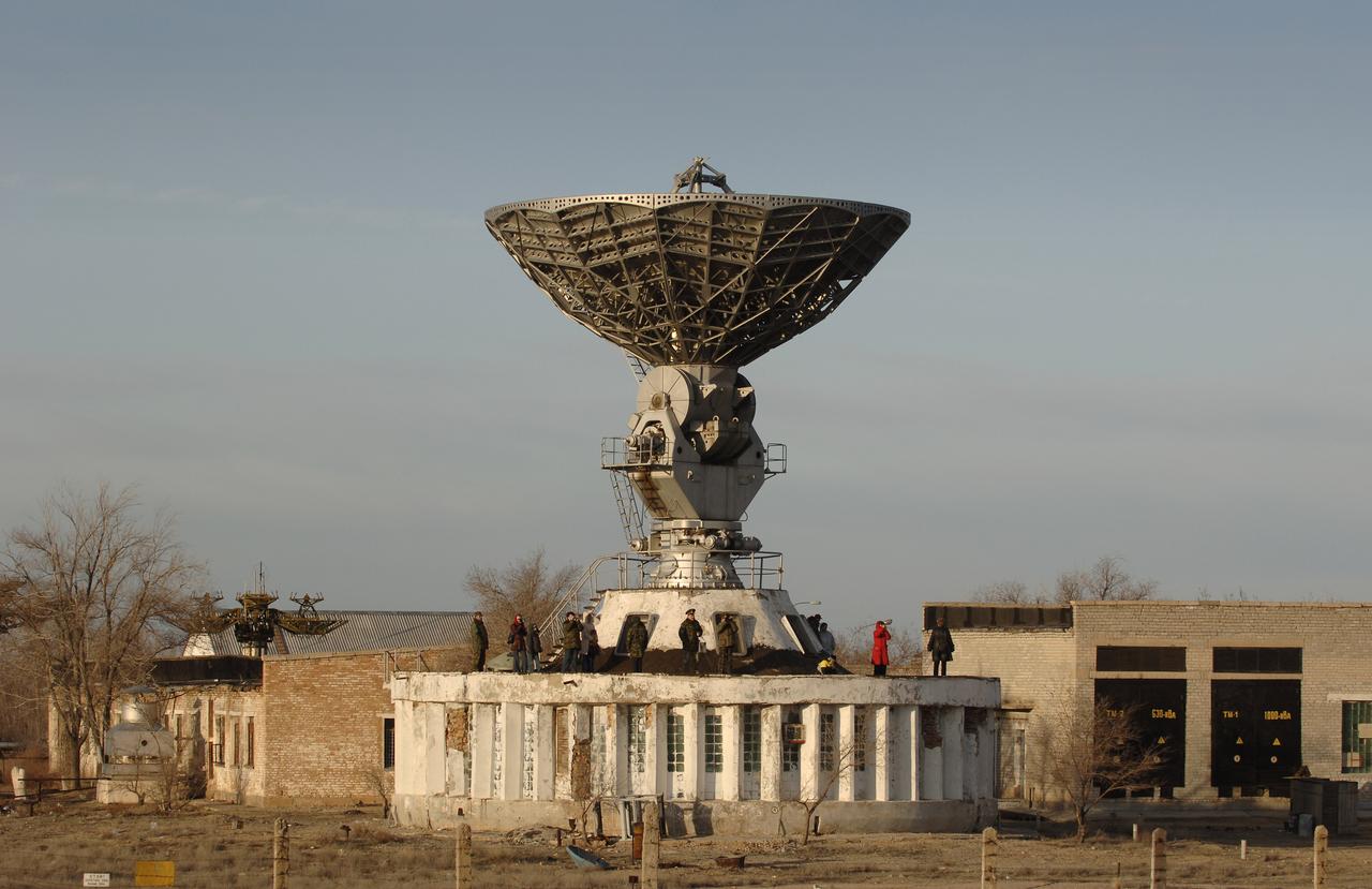Spectators try to grab the highest viewing point to watch the launch of the Soyuz spacecraft. The Soyuz TMA-8 spacecraft launched with Expedition 13 crew members Pavel V. Vinogradov, Commander; Jeffrey N. Williams, Science Officer and Flight Engineer; and Marcos Pontes, Brazilian Space Agency Soyuz crew member. They began their mission Wednesday evening launching from Baikonur, Kazakhstan at 8:30 a.m. (Kazakhstan time). Pontes will return home with Expedition 12 on April 8, 2006. Photo Credit: (NASA/Bill Ingalls)