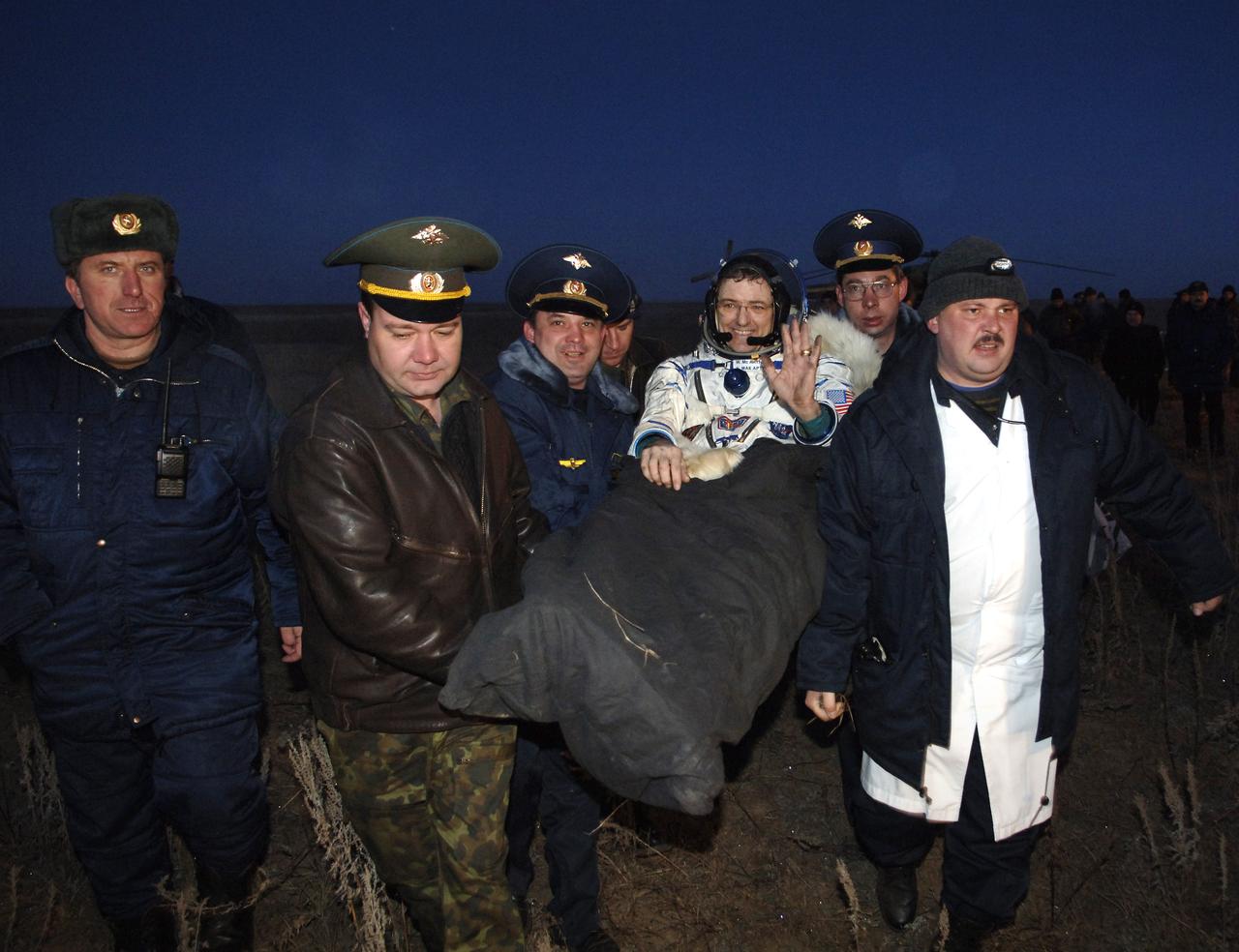 William S. McArthur Jr., Expedition 12 Commander and Space Station Science Officer, waves to some of the crowd on hand in the steppes of Kazakhstan to greet the three crewmembers returning to Earth from the International Space Station in the Soyuz TMA-7 spacecraft on Sunday, April 9, 2006. Returning with McArthur, Flight Engineer Valery Tokarev and Brazil’s first astronaut, Marcos Pontes, who arrived at the station with Expedition 13 on April 1. Photo Credit: (NASA/Bill Ingalls)