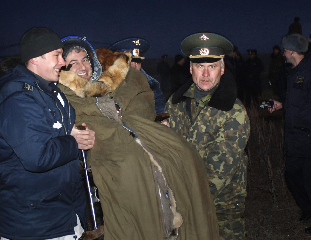 Brazil’s first astronaut in space, Marcos C. Pontes smiles as he exchanges greetings with some of the crowd on hand in the steppes of Kazakhstan to meet him and the two Expedition 12 crewmembers returning to Earth from the International Space Station in the Soyuz TMA-7 spacecraft, Sunday April 9, 2006. Pontes spent a little over a week onboard the orbital outpost. Returning with Pontes were Expedition 12 Commander Bill McArthur and Flight Engineer Valery Tokarev. Photo Credit: (NASA/Bill Ingalls)