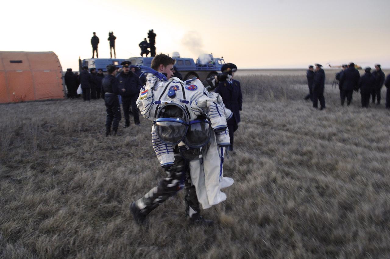 The Russian Sokol Suits are carried from the medical tent after the landing of the Soyuz TMA-7 spacecraft in the steppes of Kazakhstan. The Soyuz TMA-7 spacecraft touched down at 7:48 p.m. EDT on Saturday, April 9, 2006. Returning with Expedition 12 Commander Bill McArthur and Flight Engineer Valery Tokarev was Brazil’s first astronaut, Marcos Pontes, who arrived at the station with Expedition 13 on Sunday, April 1, 2006. Photo Credit: (NASA/Bill Ingalls)