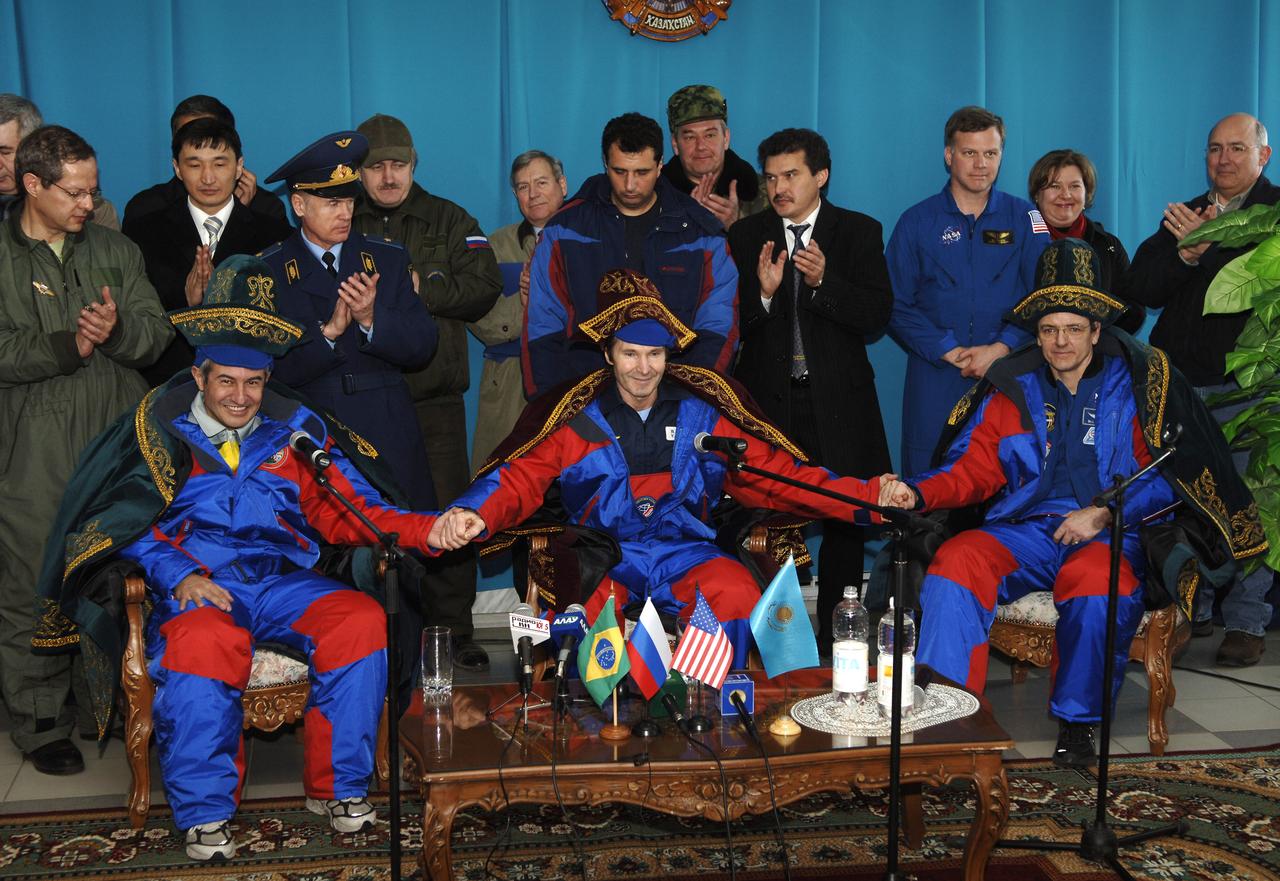 Brazilian astronaut Marcos C. Pontes, left, Expedition 12 crew members, Valery I. Tokarev, Flight Engineer and Soyuz Commander, and William S. (Bill) McArthur, Jr., right, Expedition 12 commander and space station Science Officer. Expedition 12 returned to Earth and landed in the steppes of Kazakhstan. The Soyuz TMA-7 spacecraft touched down at 7:48 p.m. EDT, Sunday, April 9, 2006. Photo Credit: (NASA/Bill Ingalls)