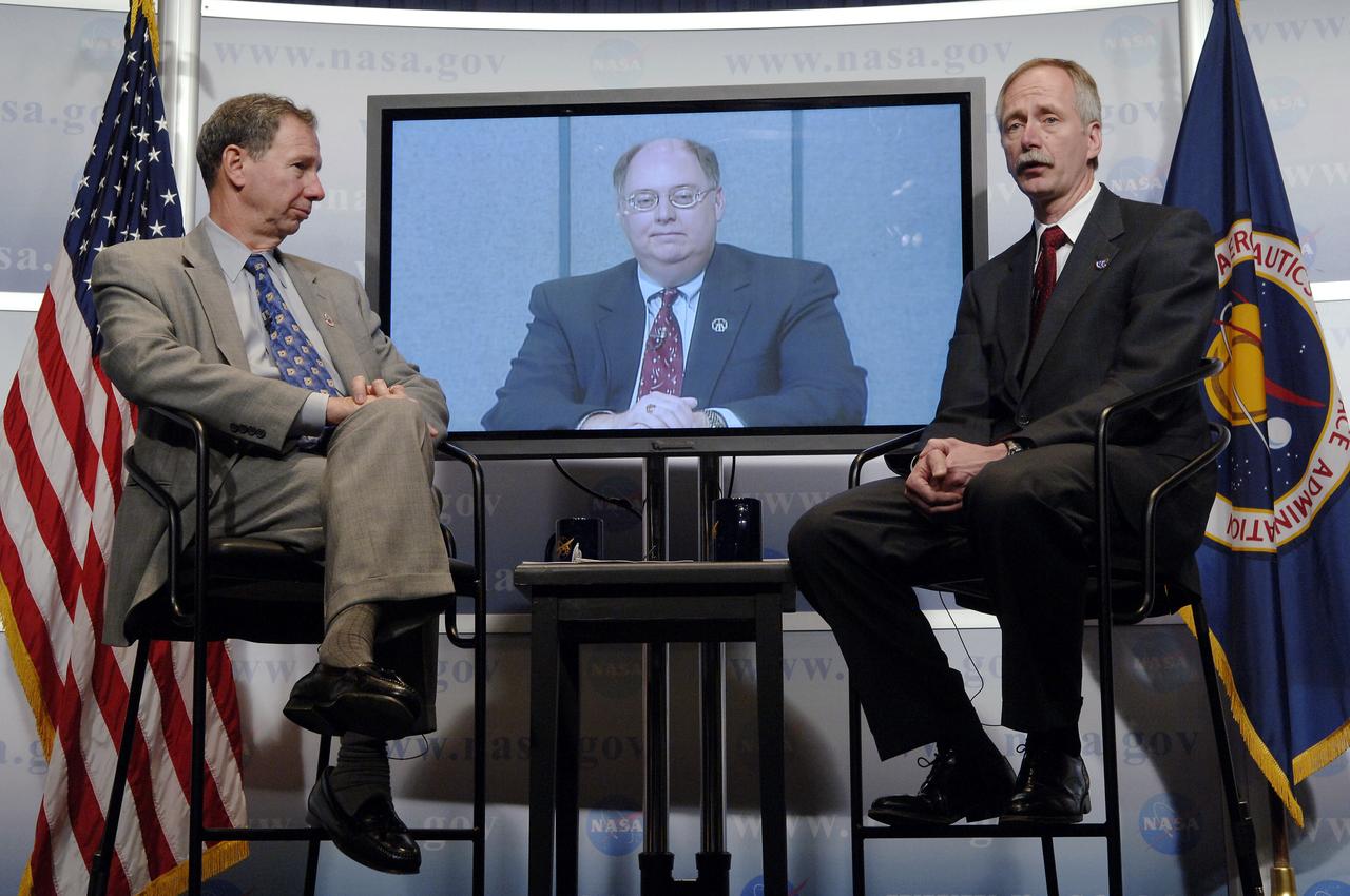 NASA Administrator Michael Griffin, left, looks on as Associate Administrator for Space Operations William Gerstenmaier, right, speaks while Space Shuttle Program Manager Wayne Hale of NASA's Marshall Space Flight Center waits by during a media briefing about the space shuttle program and processing for the STS-121 mission, Friday, April 28, 2006, at NASA Headquarters in Washington. Photo Credit (NASA/Bill Ingalls)