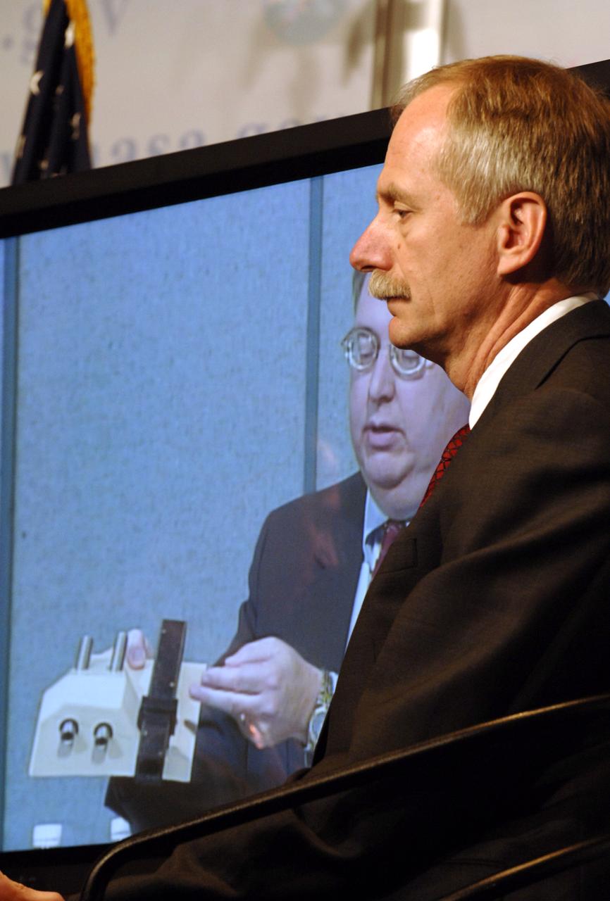 NASA Associate Administrator for Space Operations William Gerstenmaier, right, look on as Space Shuttle Program Manager Wayne Hale speaks from NASA's Marshall Space Flight Center during a media briefing about the space shuttle program and processing for the STS-121 mission, Friday, April 28, 2006, at NASA Headquarters in Washington. Photo Credit (NASA/Bill Ingalls)