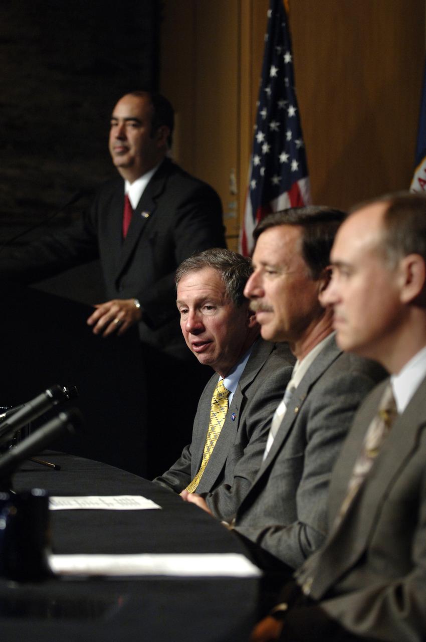 NASA Administrator Michael Griffin, seated left, Scott Horowitz, NASA Associate Administrator for Exploration Systems and Jeff Hanley, Constellation Program Manager, right, are seen during a press conference outlining specific center responsibilities associated with the Constellation Program for robotic and human moon and Mars exploration, Monday, June 5, 2006, at NASA Headquarters in Washington. Dean Acosta, NASA Deputy Assistant Administrator and Press Secretary, far left, moderates the program. Photo Credit (NASA/Bill Ingalls)