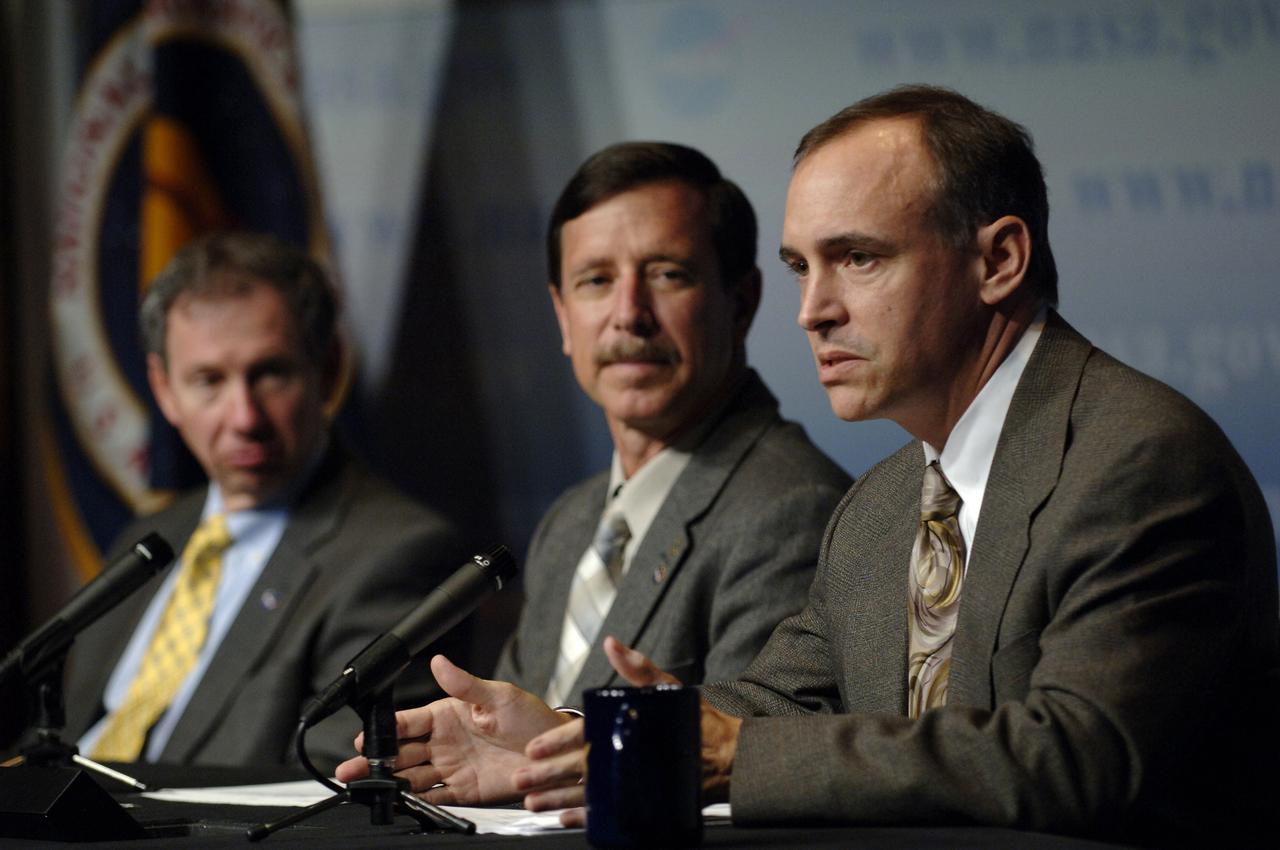 Jeff Hanley, Constellation Program Manager, right, announces to NASA employees and members of the media the responsibilities of the NASA centers associated with the Constellation Program for robotic and human Moon and Mars exploration on Wednesday, June 5, 2006, at NASA Headquarters in Washington. Hanley is joined by Scott J. Horowitz, NASA Associate Administrator for Exploration Systems and NASA Administrator Michael Griffin, left. Photo Credit: (NASA/Bill Ingalls)