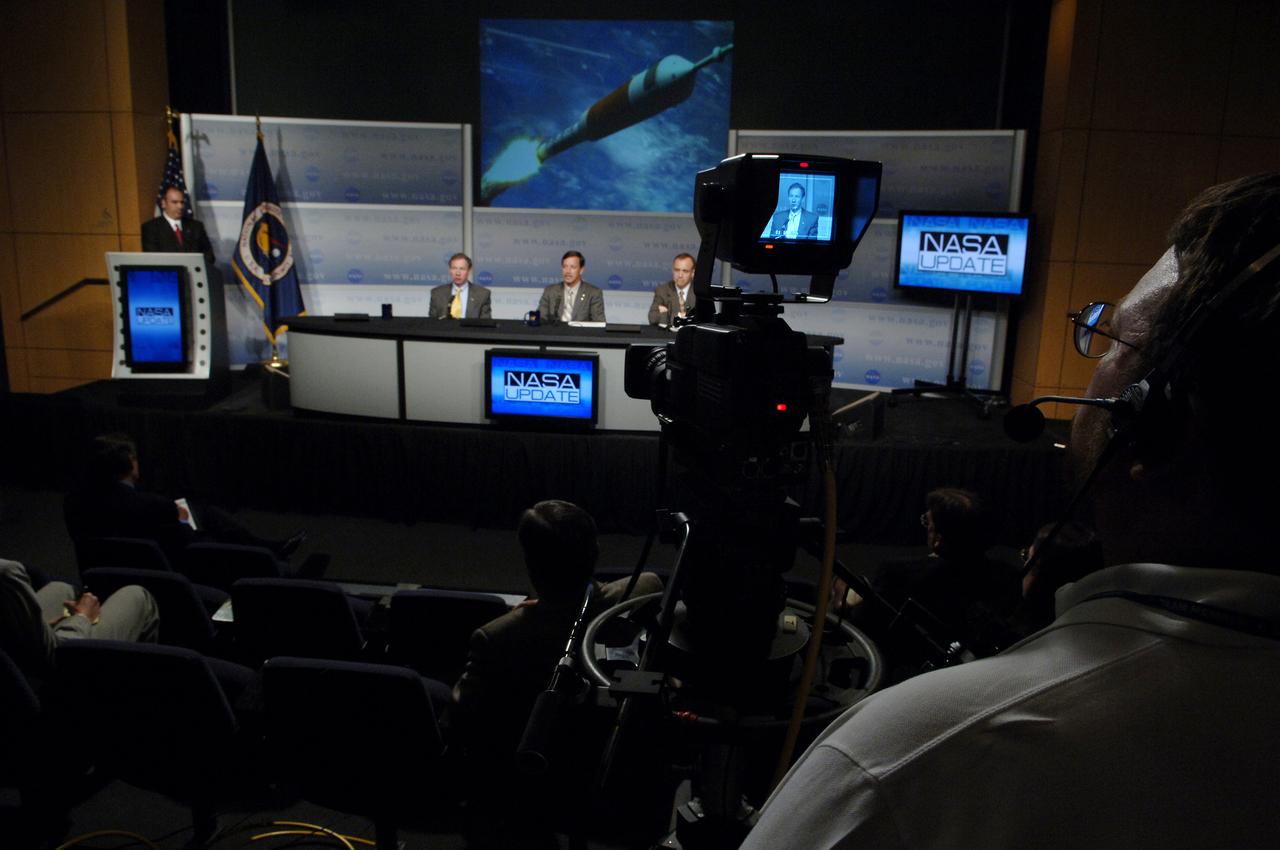 NASA Administrator Michael Griffin is seen through a television camera at a NASA Update announcing to NASA employees and members of the media the responsibilities of the NASA centers associated with the Constellation Program for robotic and human Moon and Mars exploration on Wednesday, June 5, 2006, at NASA Headquarters in Washington. Griffin was joined by Scott J. Horowitz, NASA Associate Administrator for Exploration Systems and Jeff Hanley, Constellation Program Manager, right. Dean Acosta, NASA Deputy Assistant Administrator and Press Secretary, far left, moderates the program. Photo Credit: (NASA/Bill Ingalls)