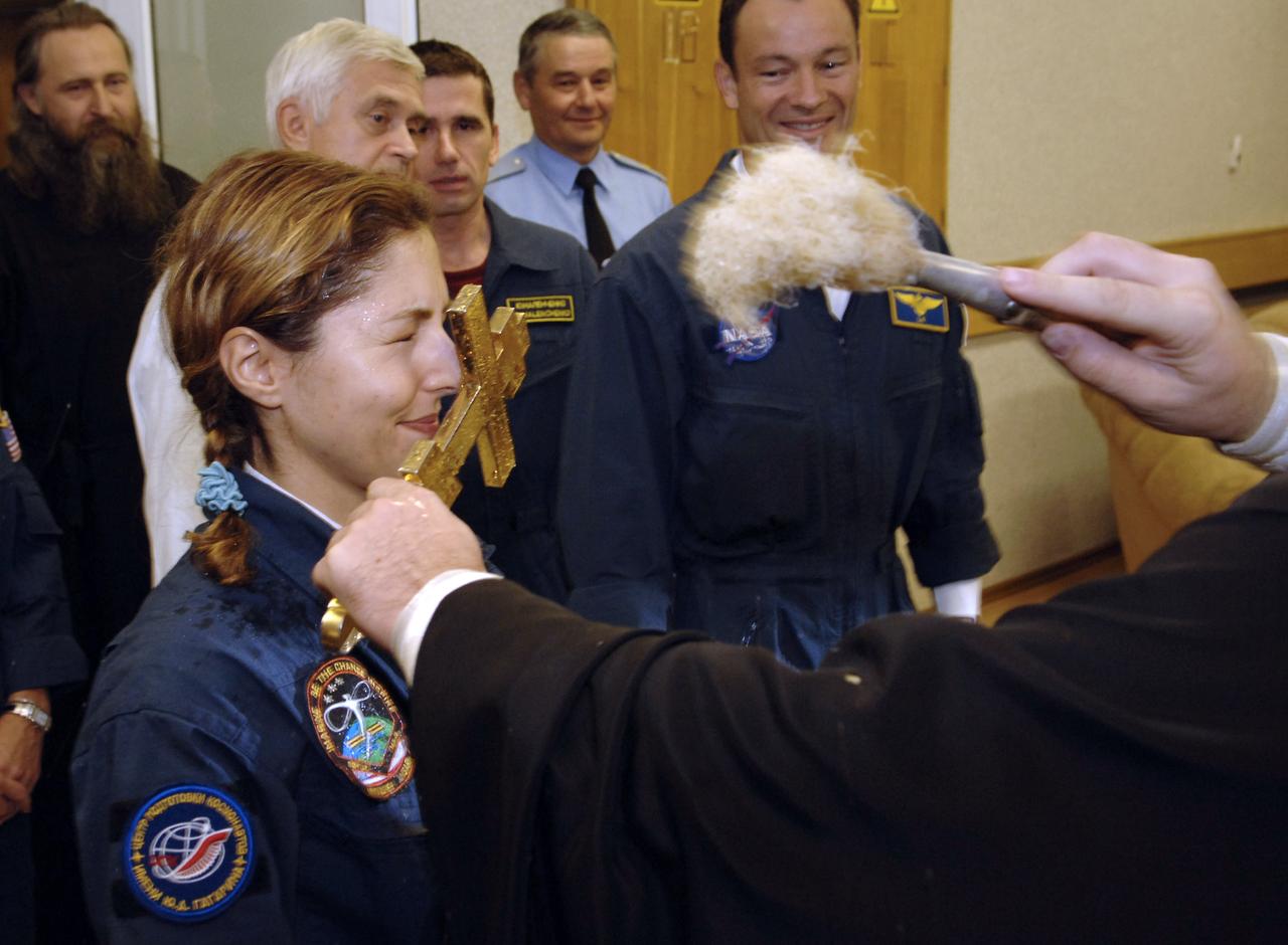 American spaceflight participant Anousheh Ansari receives a blessing at the Cosmonaut Hotel the morning of her launch onboard the Soyuz TMA-9 spacecraft, Monday, Sept. 18, 2006 in Baikonur, Kazakhstan.  Ms Ansari, will spend nine days on the International Space Station under a commercial agreement with the Russian Federal Space Agency.  Photo Credit: (NASA/Bill Ingalls)