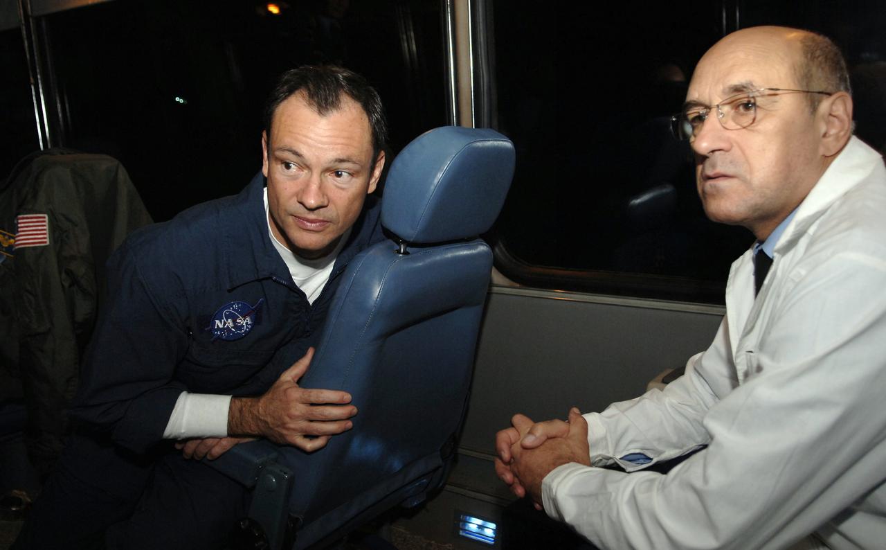 Expedition 14 Commander Michael Lopez-Alegria, left, rides the bus with doctors and his fellow crew mates from the Cosmonaut Hotel to building 254 at the Baikonur Cosmodrome where they will suit up for launch, Monday, Sept. 18, 2006 in Kazakhstan. The Soyuz TMA-9 spacecraft launched from the Baikonur Cosmodrome at 10:09 a.m. local time carrying Expedition 14 Commander Michael Lopez-Alegria, Soyuz Commander and Expedition 14 Flight Engineer Mikhail Tyurin and American spaceflight participant Anousheh Ansari, who will spend nine days on the International Space Station under a commercial agreement with the Russian Federal Space Agency. Photo Credit: (NASA/Bill Ingalls)
