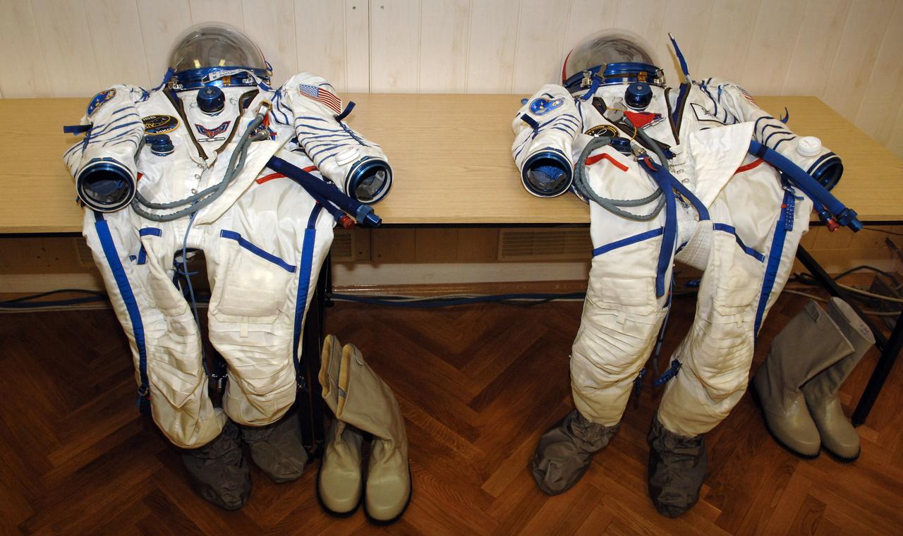 Russian Sokol suits await crew members during suit up at the Baikonur Cosmodrome, Monday, Sept. 18, 2006, in Kazakhstan. The Soyuz TMA-9 spacecraft launched from the Baikonur Cosmodrome at 10:09 a.m. local time carrying Expedition 14 Commander Michael Lopez-Alegria, Soyuz Commander and Expedition 14 Flight Engineer Mikhail Tyurin and American spaceflight participant Anousheh Ansari, who will spend nine days on the International Space Station under a commercial agreement with the Russian Federal Space Agency. Photo Credit: (NASA/Bill Ingalls)