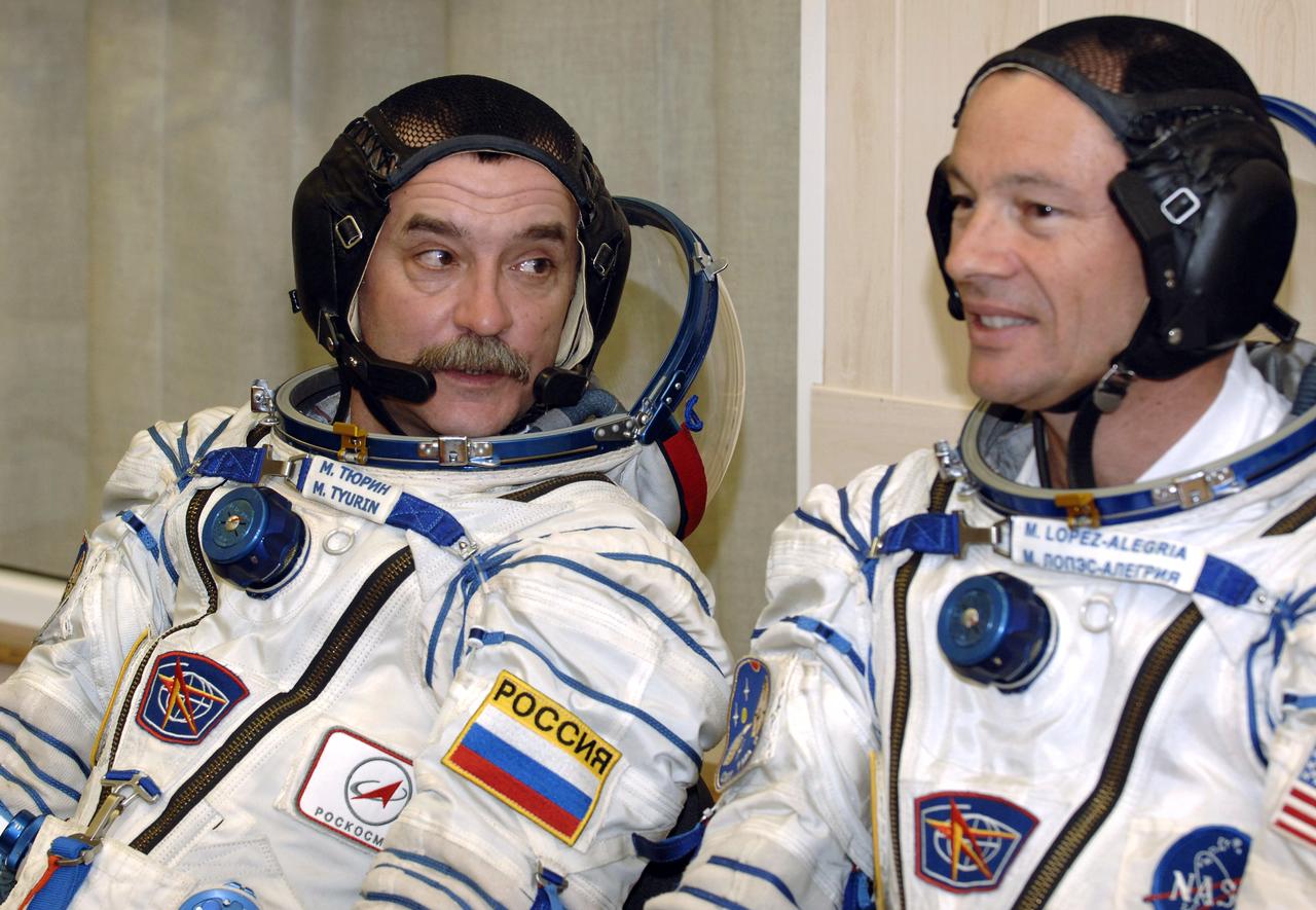 Expedition 14 Flight Engineer and Soyuz Commander Mikhail Tyurin, left, and Expedition 14 Commander Michael Lopez-Alegria talk as they prepare for pressure checks on their Russian Sokol suits at the Baikonur Cosmodrome, Monday, Sept. 18, 2006, in Kazakhstan. Their Soyuz TMA-9 spacecraft launched from the Baikonur Cosmodrome at 10:09 a.m. local time carrying Expedition 14 Commander Michael Lopez-Alegria, Soyuz Commander and Expedition 14 Flight Engineer Mikhail Tyurin and American spaceflight participant Anousheh Ansari, who will spend nine days on the International Space Station under a commercial agreement with the Russian Federal Space Agency. Photo Credit: (NASA/Bill Ingalls)