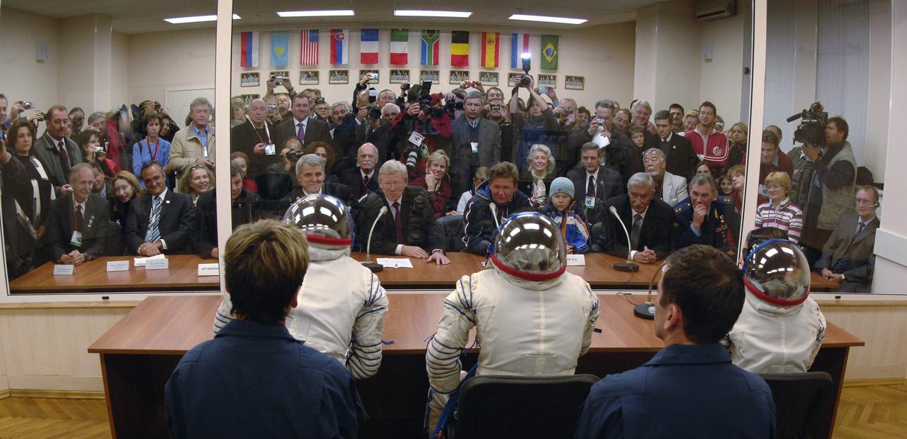 Seated at table with back to camera, Expedition 14 Commander Michael Lopez-Alegria, left, Soyuz Commander and Expedition 14 Flight Engineer Mikhail Tyurin and American spaceflight participant Anousheh Ansari, right, and their backup crew meet with Russian and American officials moments before boarding the bus to head to the Soyuz launch pad, Monday, Sept. 18, 2006 in Baikonur, Kazakhstan. The Soyuz TMA-9 spacecraft launched from the Baikonur Cosmodrome at 10:09 a.m. local time. Anousheh Ansari will spend nine days on the International Space Station under a commercial agreement with the Russian Federal Space Agency. Photo Credit: (NASA/Bill Ingalls)