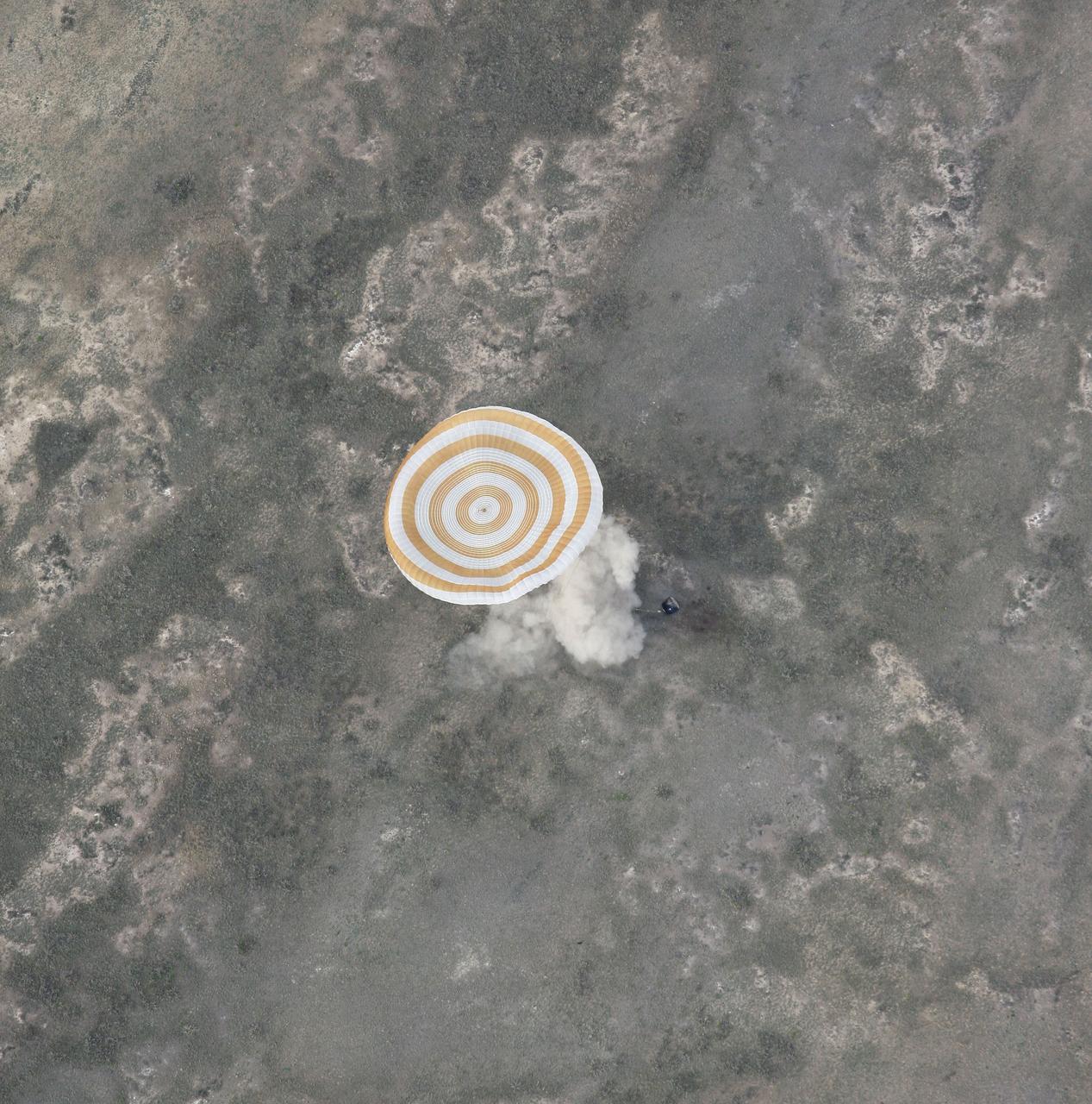 Expedition 14 Commander Michael Lopez-Alegria, Flight Engineer Mikhail Tyurin and American spaceflight participant Charles Simonyi land in their Soyuz TMA-9 spacecraft southwest of Karaganda, Kazakhstan at approximately 6:30 p.m. local time, Friday, April 21, 2007. Photo Credit: (NASA/Bill Ingalls)