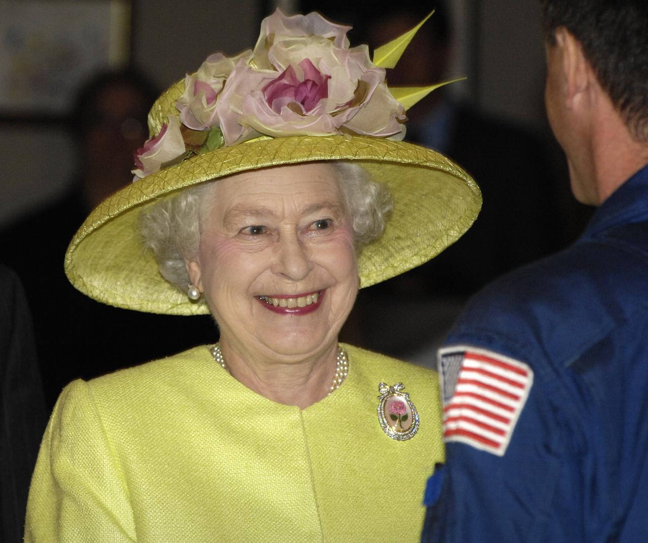 Queen Elizabeth II, left, prepares to talk with the International Space Station crew along with NASA astronaut Michael Foale, right, and NASA Administrator Michael Griffin (not pictured) from NASA’s Goddard Space Flight Center‘s Operational Control Room, Tuesday, May 8, 2007, in Greenbelt, Md. NASA Goddard was one of the last stops on the Queen's six-day visit to the United States. Photo Credit: (NASA/Bill Hrybyk)