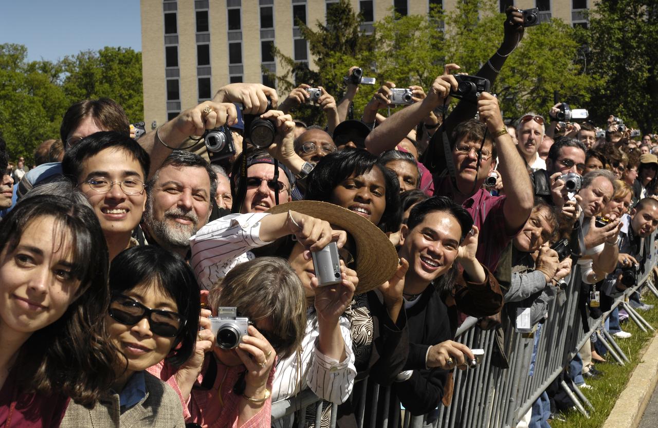 Employees at NASA's Goddard Space Flight Center wait to greet Queen Elizabeth II, Tuesday, May 8, 2007, in Greenbelt, Md.  Queen Elizabeth II and her husband, Prince Philip, Duke of Edinburgh, visited the NASA Goddard Space Flight Center as one of the last stops on their six-day United States visit. Photo Credit: (NASA/Bill Ingalls)