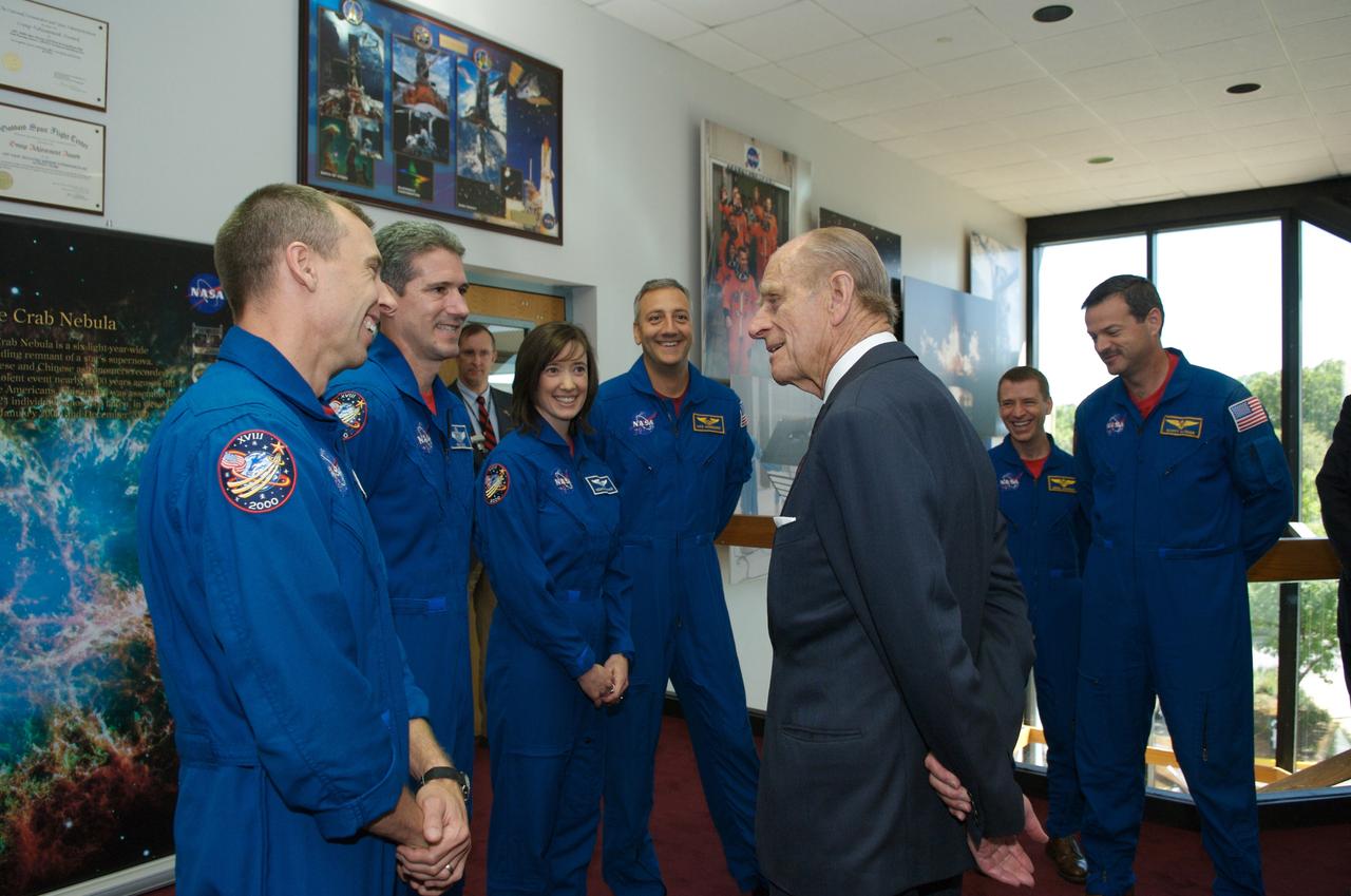 Prince Philip greets astronauts from STS-125 L to R Andrew J Feustel, Michael T Goode, K. Megan McArthur, Michael J. Massimino, Gregory C. Johnson, and Commander Scott D. Altman. Photo Credit: (NASA/Chris Gunn)