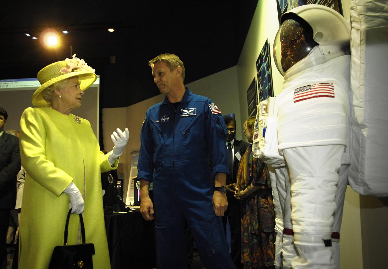 Queen Elizabeth II talks with NASA astronaut Piers Sellers at NASA's Goddard Spaceflight Center, Tuesday, May 8, 2007, in Greenbelt, Md.  Queen Elizabeth II and her husband, Prince Philip, Duke of Edinburgh, visited the NASA Goddard Space Flight Center as one of the last stops on their six-day United States visit. Photo Credit: (NASA/Pat Izzo)