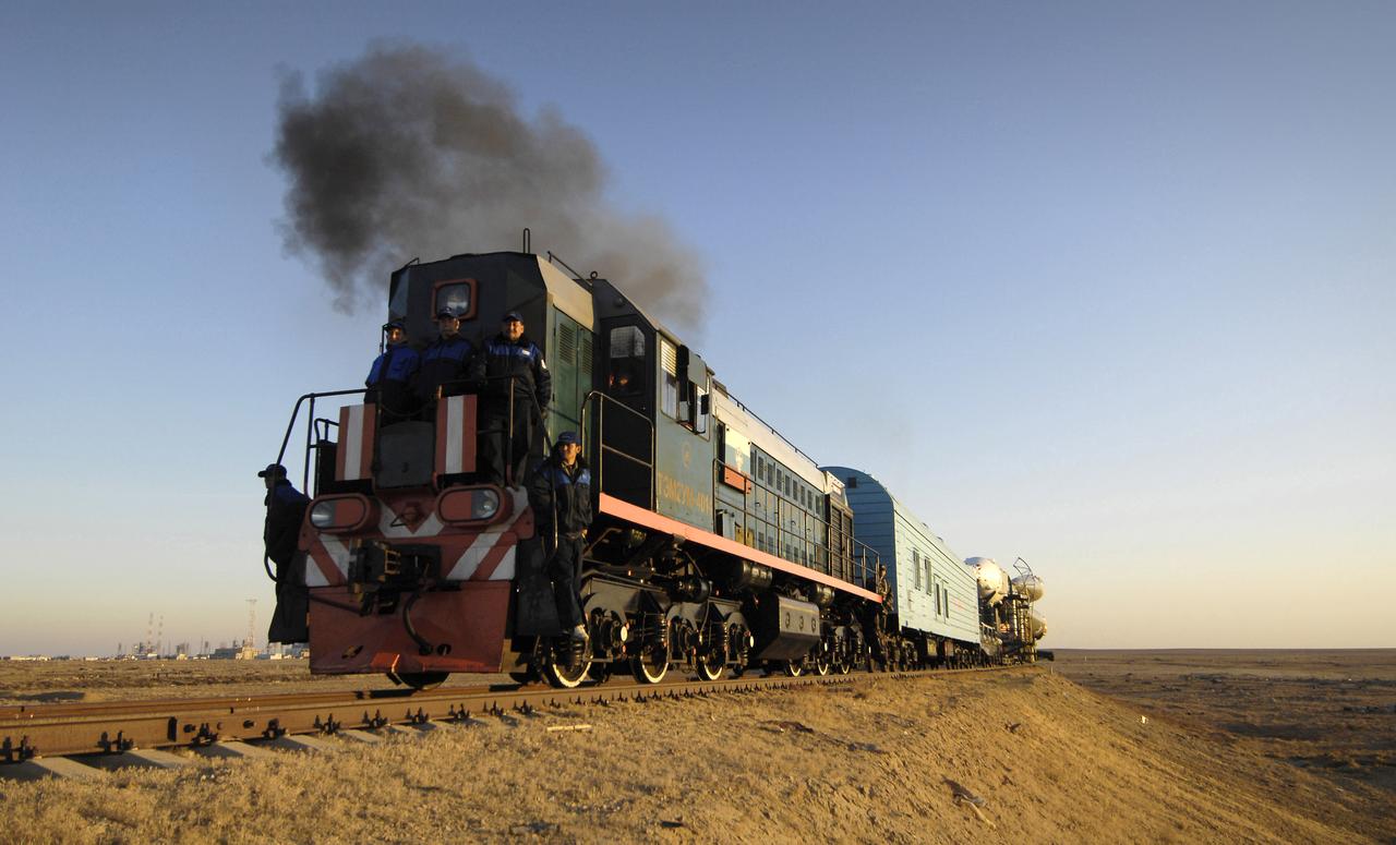 The Soyuz TMA-11 spacecraft is transported by railcar to its launch pad at the Baikonur Cosmodrome, Monday, Oct. 8, 2007, in Kazakhstan for an October 10th launch date.  The Soyuz will carry Expedition 16 Commander Peggy Whitson, Flight Engineer and Soyuz Commander Yuri Malenchenko and Malaysian spaceflight participant Sheikh Muszaphar Shukor to the International Space Station.  Whitson and Malenchenko will spend six months on the station.  Shukor, who is flying under an agreement between Malaysia and the Russian Federal Space Agency, will return to Earth October 21 with two of the Expedition 15 crew members currently on the complex.  Photo Credit:  (NASA/Bill Ingalls)