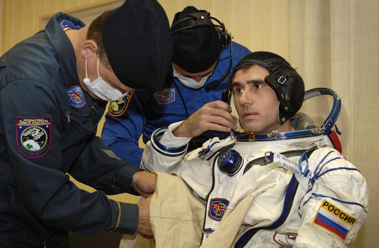 Expedition 16 Flight Engineer and Soyuz Commander Yuri Malenchenko dons his flight suit prior to launch, Wednesday, Oct. 10, 2007, in Baikonur, Kazakhstan. Expedition 16 Commander Peggy Whitson, Malenchenko, and Malaysian spaceflight participant Sheikh Muszaphar Shukor launched from the Baikonur Cosmodrome in Kazakhstan at sunset n their Soyuz TMA-11 spacecraft bound for a docking to the International Space Station on Oct. 12. Whitson and Malenchenko will spend six months on the station, while Shukor will return to Earth Oct. 21 with two of the Expedition 15 crewmembers currently on the complex. Photo Credit: (NASA/Bill Ingalls)