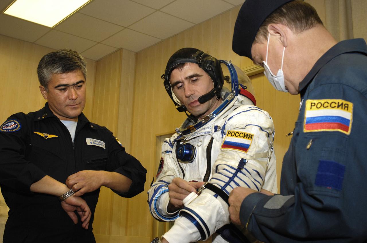 Expedition 16 Flight Engineer and Soyuz Commander Yuri Malenchenko dons his flight suit prior to launch, Wednesday, Oct. 10, 2007, in Baikonur, Kazakhstan. Expedition 16 Commander Peggy Whitson, Malenchenko, and Malaysian spaceflight participant Sheikh Muszaphar Shukor launched from the Baikonur Cosmodrome in Kazakhstan at sunset n their Soyuz TMA-11 spacecraft bound for a docking to the International Space Station on Oct. 12. Whitson and Malenchenko will spend six months on the station, while Shukor will return to Earth Oct. 21 with two of the Expedition 15 crewmembers currently on the complex. Photo Credit: (NASA/Bill Ingalls)