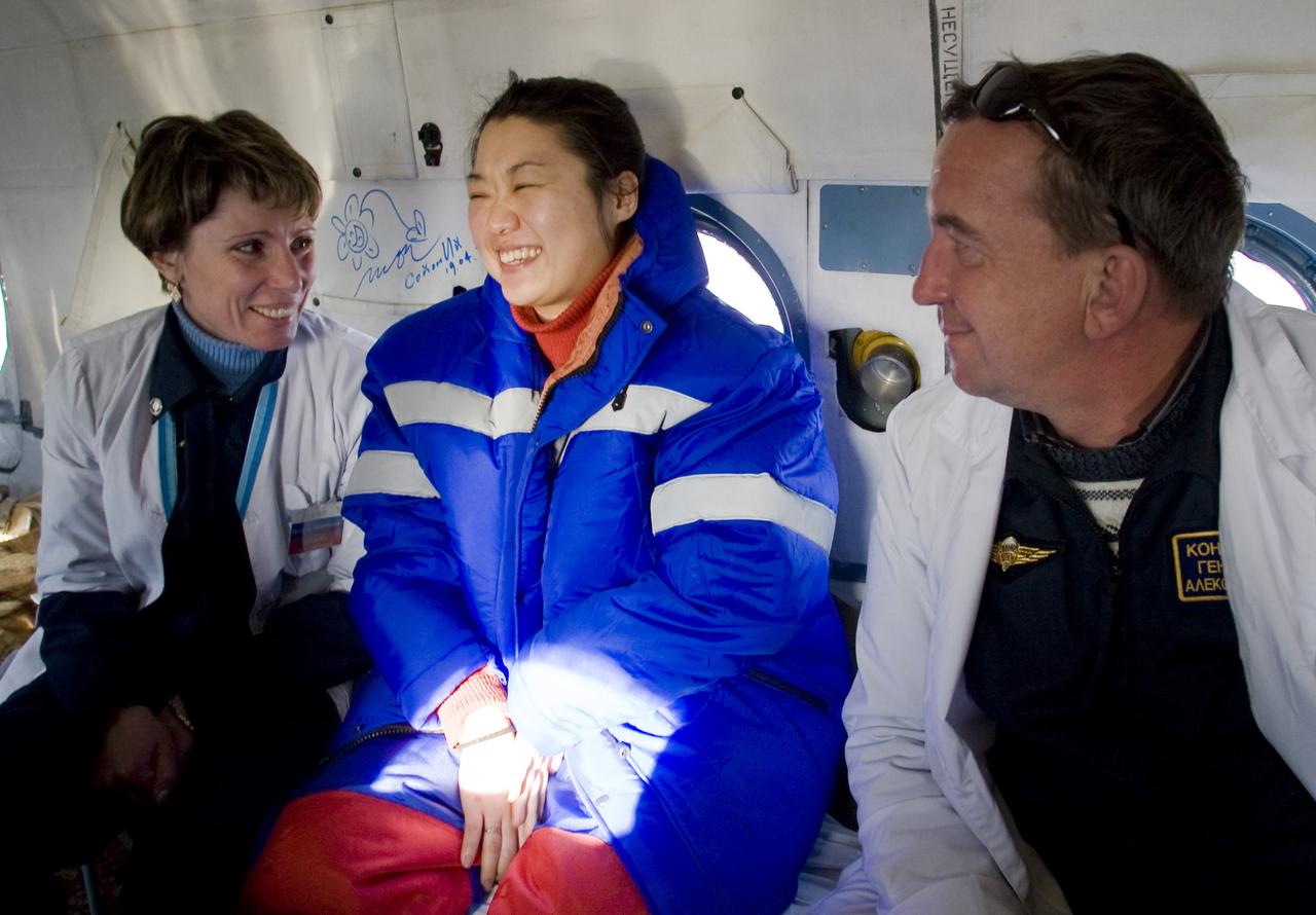 South Korean spaceflight participant So-Yeon YI jokes with Russian doctors in a helicopter after she and fellow crew members Expedition 16 Commander Peggy Whitson and Flight Engineer and Soyuz Commander Yuri Malenchenko landed their Soyuz TMA-11 capsule, Friday, April 19, 2008, in central Kazakhstan.  Whitson and Malenchenko completed 192 days in space and Yi 11 days in orbit.  Photo Credit: (NASA/Reuters/Pool)