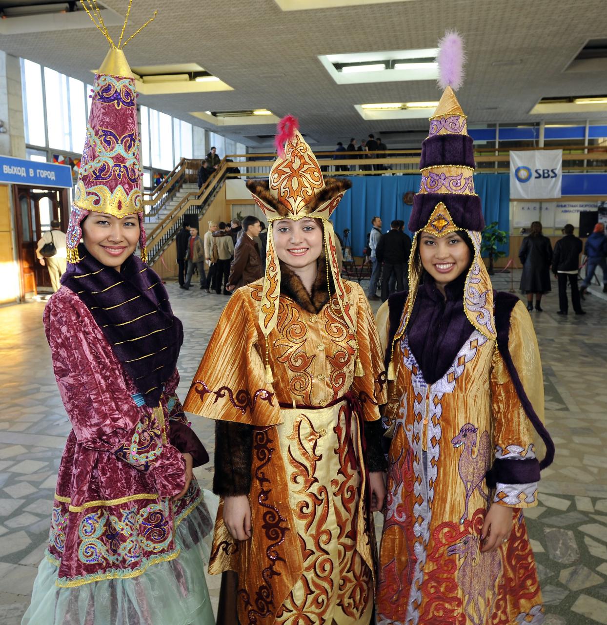 Women in traditional Kazakh dress wait to welcome Expedition 16 Commander Peggy Whitson, Flight Engineer and Soyuz Commander Yuri Malenchenko and South Korean spaceflight participant So-yeon Yi at the Kustanay airport in Kazakhstan, Friday, April 19, 2008.  Whitson, Malenchenko and Yi landed their Soyuz TMA-11 capule in central Kazakhstan to complete 192 days in space for Whitson and Malenchenko and 11 days in orbit for Yi.  Photo Credit: (NASA/Bill Ingalls)