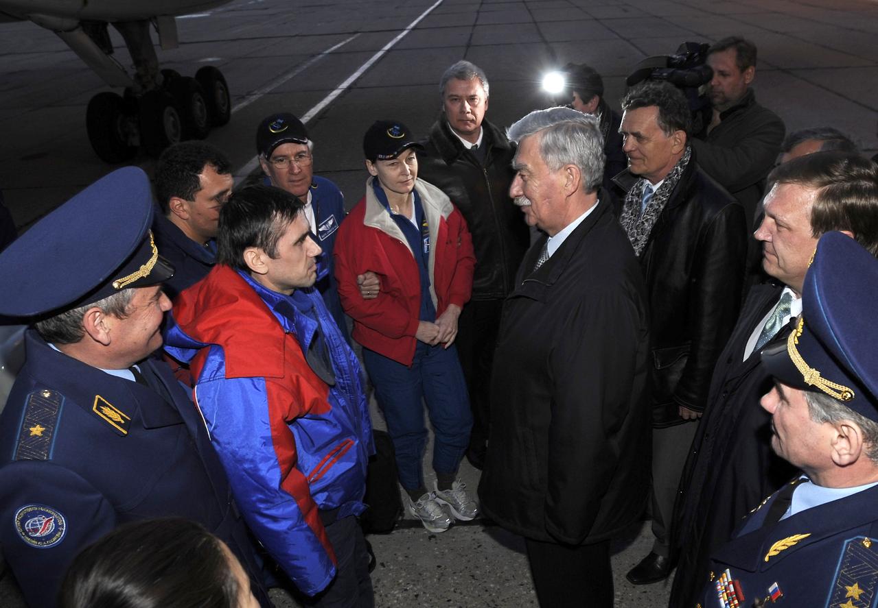 Expedition 16 Flight Engineer and Soyuz Commander Yuri Malenchenko, second from left, and Expedition 16 Commander Peggy Whitson meet with Russian officials at the foot of the airplane steps after they arrived at Chkalovsky Airport near Star City, Russia, Friday, April 19, 2008. Whitson, Malechenko and Yi landed their Soyuz TMA-11 spacecraft on April 19, 2008 in central Kazakhstan to complete 192 days in space for Whitson and Malenchenko and 11 days in orbit for Yi. Photo Credit: (NASA/Bill Ingalls)