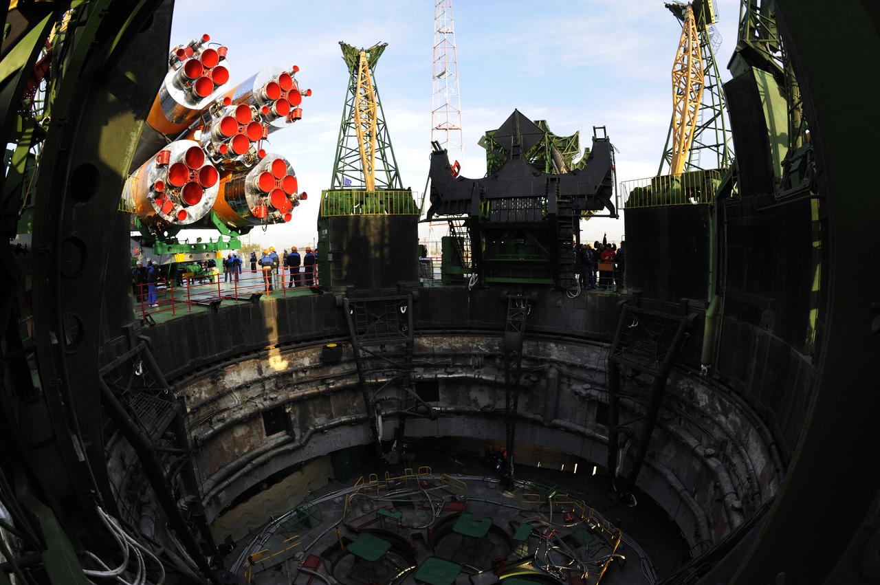 The Soyuz TMA-13 spacecraft arrives at the launch pad at the Baikonur Cosmodrome in Kazakhstan, Friday, Oct. 10, 2008.   The Soyuz is scheduled to launch to the International Space Station Oct. 12 with Expedition 18 Commander Michael Fincke, Flight Engineer Yuri V. Lonchakov and American spaceflight participant Richard Garriott.  The three crew members will dock their Soyuz to the International Space Station on Oct. 14.  Fincke and Lonchakov will spend six months on the station, while Garriott will return to Earth Oct. 24 with two of the Expedition 17 crew members currently on the International Space Station.  Photo Credit: (NASA/Bill Ingalls)