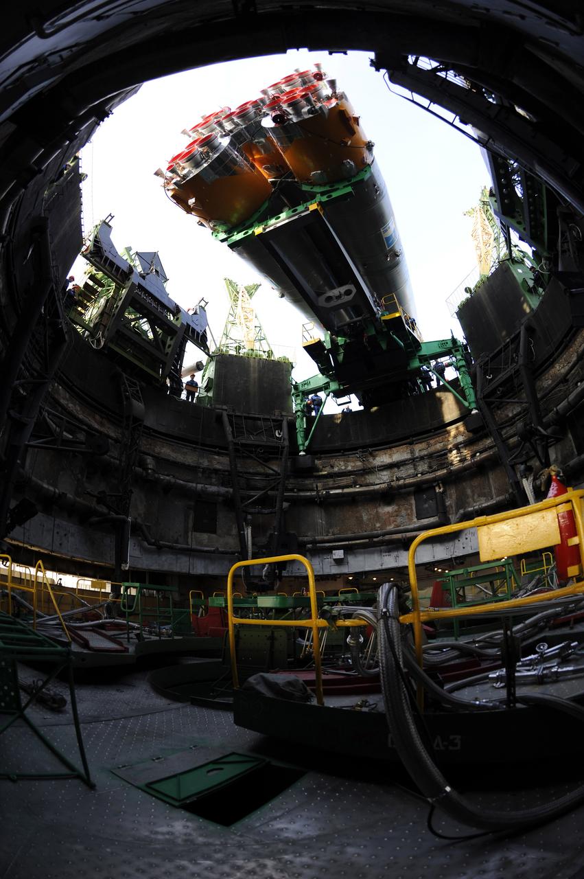 The Soyuz TMA-13 spacecraft arrives at the launch pad at the Baikonur Cosmodrome in Kazakhstan, Friday, Oct. 10, 2008.   The Soyuz is scheduled to launch to the International Space Station Oct. 12 with Expedition 18 Commander Michael Fincke, Flight Engineer Yuri V. Lonchakov and American spaceflight participant Richard Garriott.  The three crew members will dock their Soyuz to the International Space Station on Oct. 14.  Fincke and Lonchakov will spend six months on the station, while Garriott will return to Earth Oct. 24 with two of the Expedition 17 crew members currently on the International Space Station.  Photo Credit: (NASA/Bill Ingalls) 