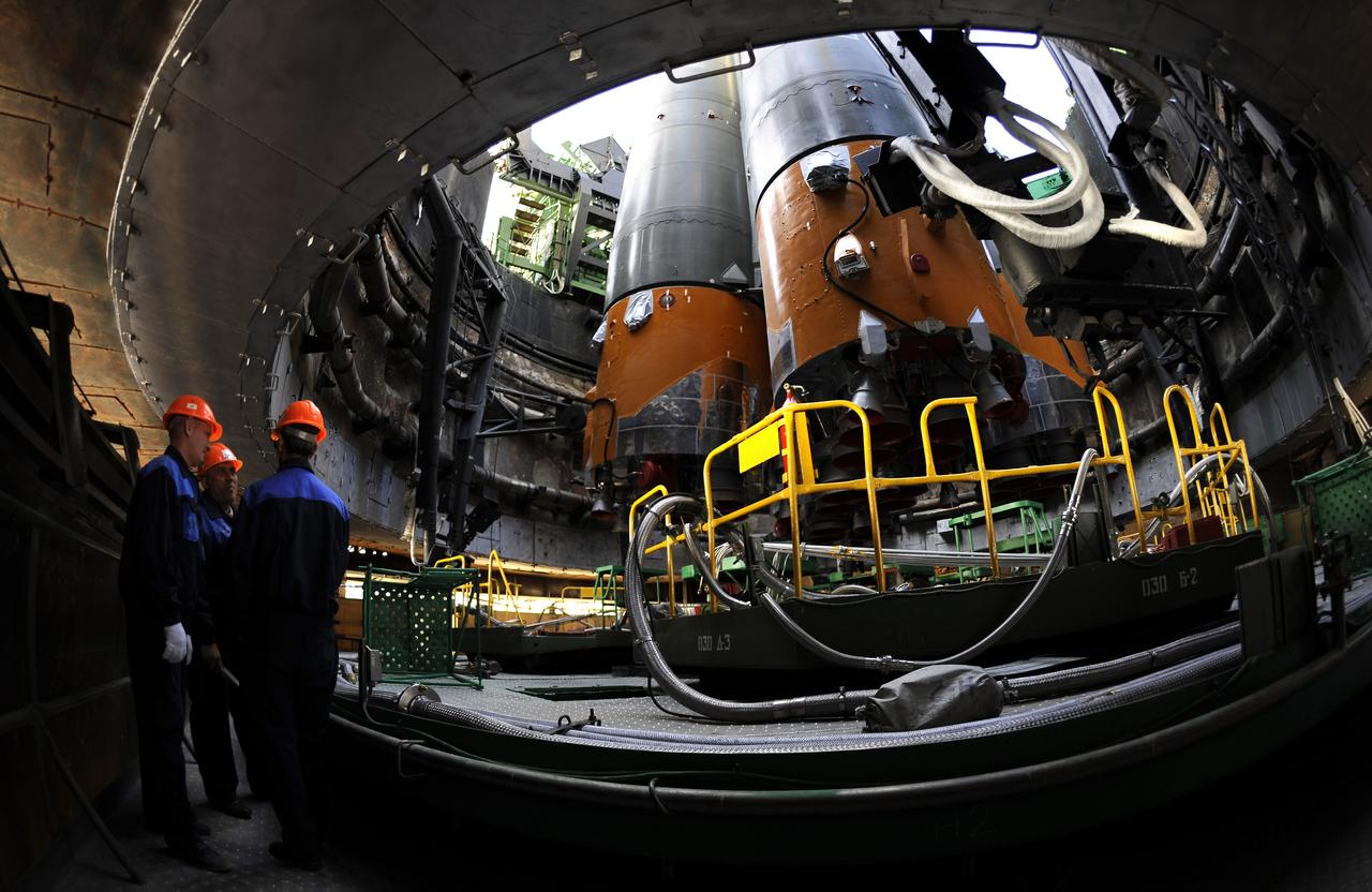The Soyuz TMA-13 spacecraft arrives at the launch pad at the Baikonur Cosmodrome in Kazakhstan, Friday, Oct. 10, 2008. The Soyuz is scheduled to launch to the International Space Station Oct. 12 with Expedition 18 Commander Michael Fincke, Flight Engineer Yuri V. Lonchakov and American spaceflight participant Richard Garriott. The three crew members will dock their Soyuz to the International Space Station on Oct. 14. Fincke and Lonchakov will spend six months on the station, while Garriott will return to Earth Oct. 24 with two of the Expedition 17 crew members currently on the International Space Station. Photo Credit: (NASA/Bill Ingalls)
