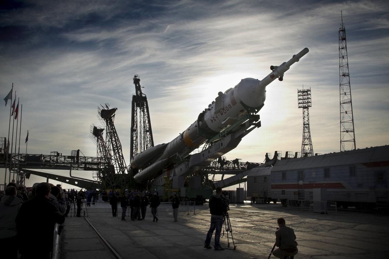 The Soyuz TMA-13 spacecraft arrives at the launch pad at the Baikonur Cosmodrome in Kazakhstan, Friday, Oct. 10, 2008. The Soyuz is scheduled to launch to the International Space Station Oct. 12 with Expedition 18 Commander Michael Fincke, Flight Engineer Yuri V. Lonchakov and American spaceflight participant Richard Garriott. The three crew members will dock their Soyuz to the International Space Station on Oct. 14. Fincke and Lonchakov will spend six months on the station, while Garriott will return to Earth Oct. 24 with two of the Expedition 17 crew members currently on the International Space Station. Photo Credit: (NASA/Bill Ingalls)