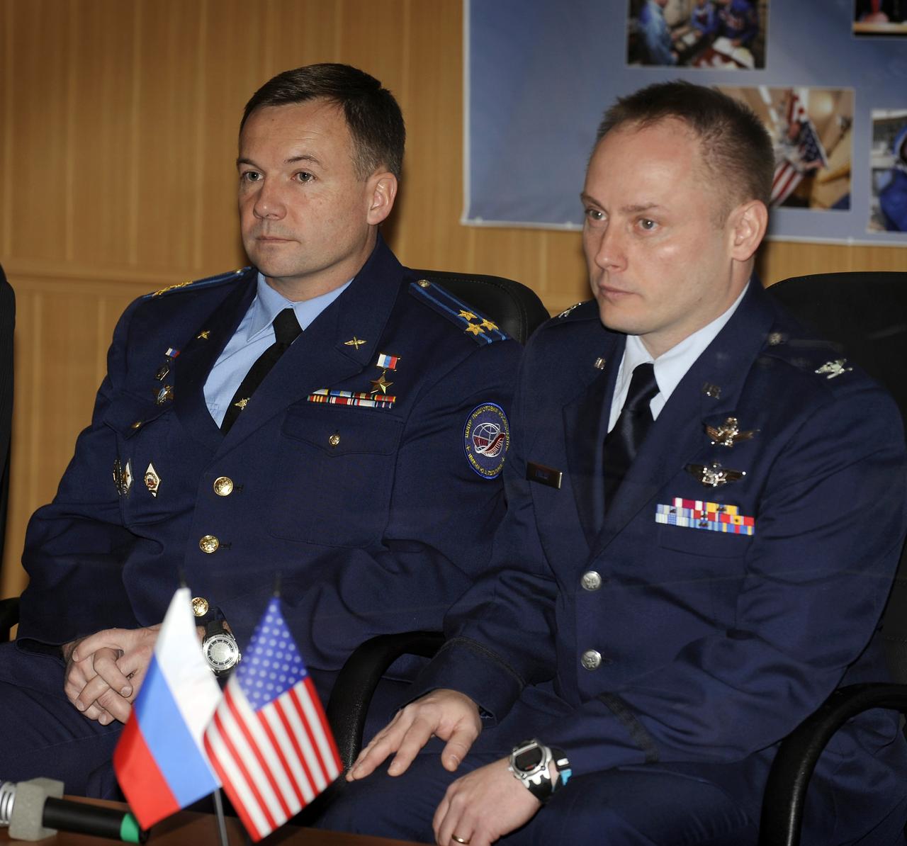 Expedition 18 Flight Engineer Yuri V. Lonchakov, left, and Expedition 18 Commander Michael Fincke listen to the State Commission give the approval for launch of the Soyuz TMA-13 spacecraft, Saturday, Oct. 11, 2008, in Baikonur, Kazakhstan. Lonchakov, Fincke and American spaceflight participant Richard Garriott are scheduled to launch Oct. 12 and then to dock with the International Space Station on Oct. 14. Fincke and Lonchakov will spend six months on the station, while Garriott will return to Earth Oct. 24 with two of the Expedition 17 crew members currently on the International Space Station. Photo Credit: (NASA/Bill Ingalls)
