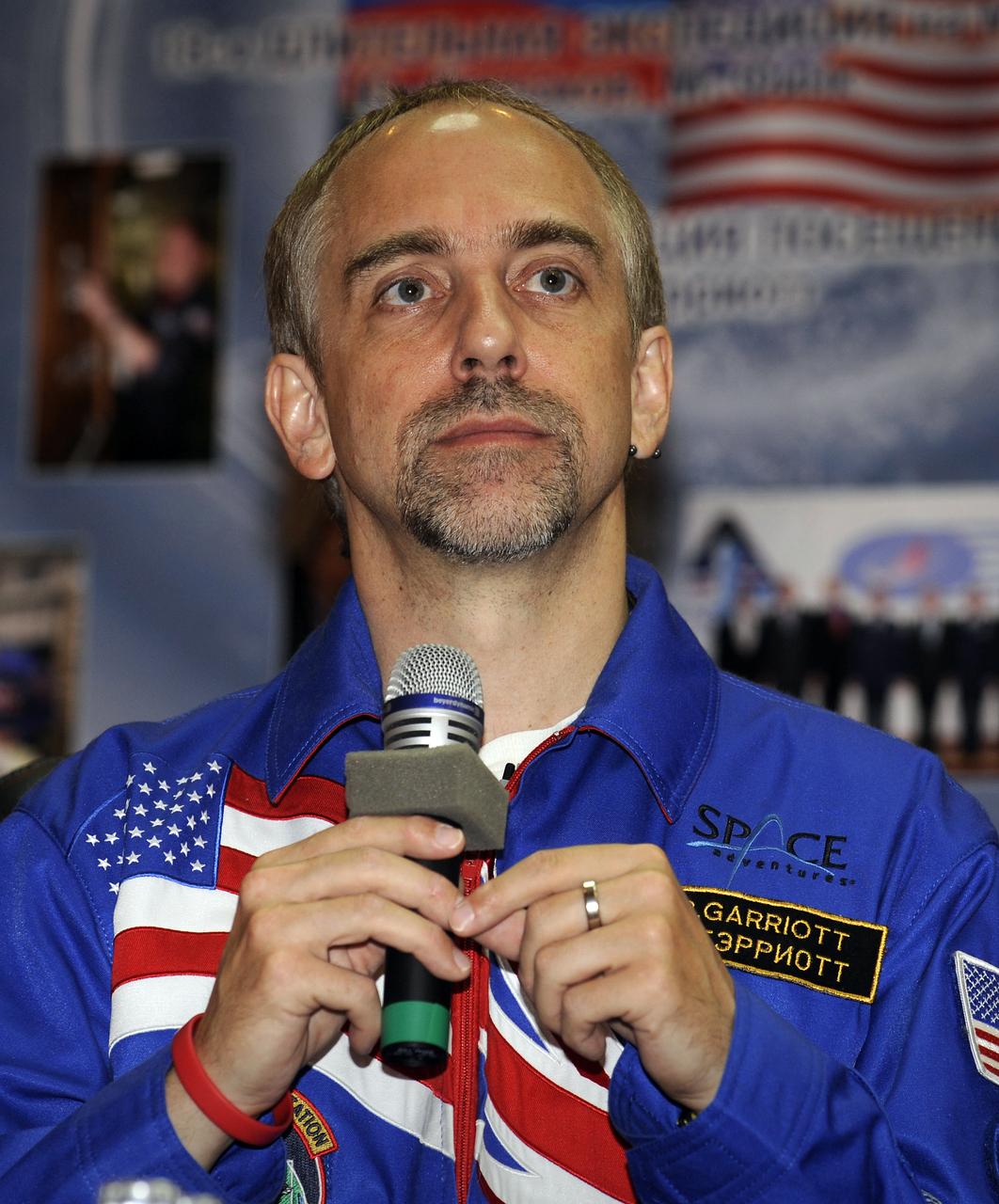 American spaceflight participant Richard Garriott answers reporters' questions during a press conference held at the Cosmonaut Hotel, Saturday, Oct. 11, 2008, in Baikonur, Kazakhstan. Garriott will launch on the Soyuz TMA-13 spacecraft along with Expedition 18 Commander Michael Fincke and Flight Engineer Yuri V. Lonchakov on Oct. 12 and dock with the International Space Station on Oct. 14. Fincke and Lonchakov will spend six months on the station, while Garriott will return to Earth Oct. 24 with two of the Expedition 17 crew members currently on the International Space Station. Photo Credit: (NASA/Bill Ingalls)