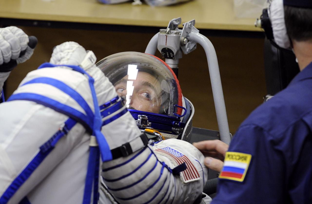 American Spaceflight Participant Richard Garriott has his Russian Sokol suit pressure checked prior to launching in the Soyuz TMA-13 spacecraft with Expedition 18 Commander Michael Fincke and Flight Engineer Yury V. Lonchakov, Sunday, Oct. 12, 2008 from the Baikonur Cosmodrome in Kazakhstan. The three crew members are scheduled to dock with the International Space Station on Oct. 14. Fincke and Lonchakov will spend six months on the station, while Garriott will return to Earth Oct. 24, 2008 with two of the Expedition 17 crewmembers currently on the International Space Station. Photo Credit: (NASA/Bill Ingalls)