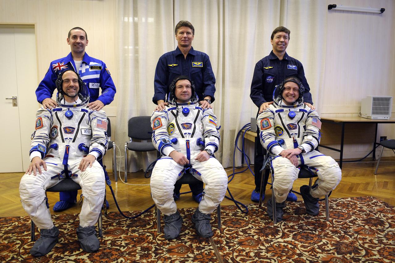 American spaceflight participant Richard Garriott, seated left, Expedition 18 Flight Engineer Yuri V. Lonchakov, Expedition 18 Commander Michael Fincke, seated right, back up spaceflight participant Nik Halik, standing left, backup Commander Gennady Padalka and backup Flight Engineer Mike Barratt pose for a photograph for the camera prior to the launch of the Soyuz TMA-13 spacecraft, Sunday, Oct. 12, 2008 from the Baikonur Cosmodrome in Kazakhstan. The three crew members are scheduled to dock with the International Space Station on Oct. 14. Fincke and Lonchakov will spend six months on the station, while Garriott will return to Earth Oct. 24 with two of the Expedition 17 crew members currently on the International Space Station. Photo Credit: (NASA/Bill Ingalls)