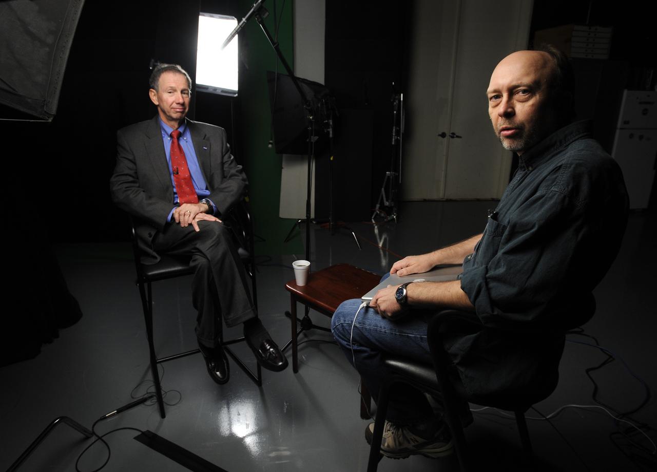 NASA Administrator Michael Griffin, left prepares for a television interview.  Thursday, Nov. 20, 2008, NASA Headquarters, Washington. Photo Credit: (NASA/Bill Ingalls)