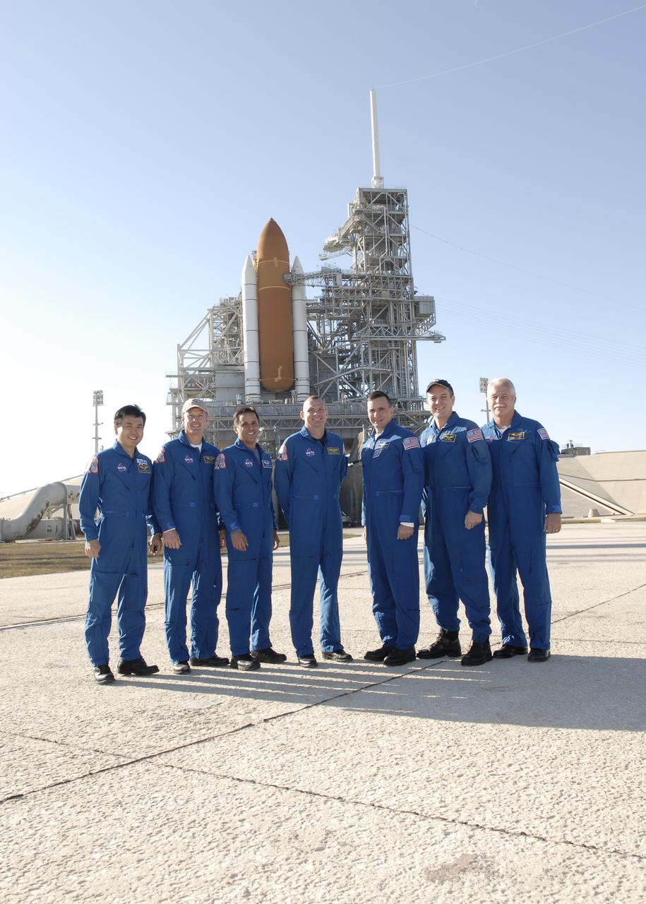 CAPE CANAVERAL, Fla. – The STS-119 crew members gather on Launch Pad 39A at NASA's Kennedy Space Center in Florida before beginning their emergency egress training. From left are Mission Specialists Koichi Wakata, Steve Swanson and Joseph Acaba, Pilot Tony Antonelli, Commander Lee Archambault and Mission Specialists Richard Arnold and John Phillips. The astronauts are at Kennedy to prepare for launch as part of the Terminal Countdown Demonstration Test activities. The TCDT includes equipment familiarization and a simulated launch countdown. The crew of space shuttle Discovery is targeted to launch on the STS-119 mission Feb. 12. During Discovery's 14-day mission, the crew will install the S6 truss segment and solar arrays to the starboard side of the International Space Station, completing the station's truss, or backbone. Photo credit: NASA_Kim Shiflett
