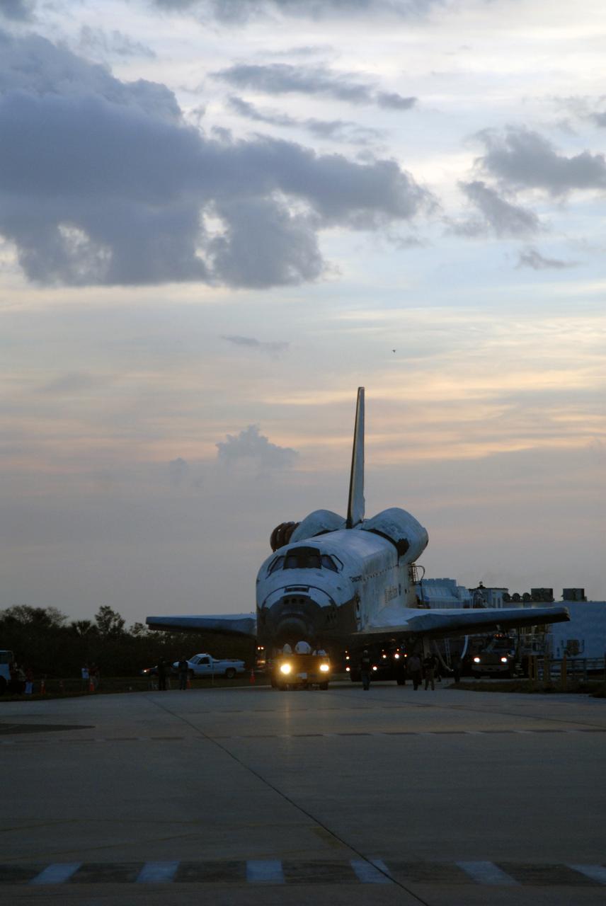 CAPE CANAVERAL, Fla. – Space shuttle Discovery is silhouetted against a fading sunset sky at NASA's Kennedy Space Center in Florida as it is towed to Orbiter Processing Facility 3. Discovery landed at 3:13:17 p.m. EDT after completing a 13-day journey of more than 5.3 million miles on the STS-119 mission. The mission was the 28th flight to the station, the 36th flight of Discovery and the 125th in the Space Shuttle Program, as well as the 70th landing at Kennedy. Photo credit: NASA_Jack Pfaller